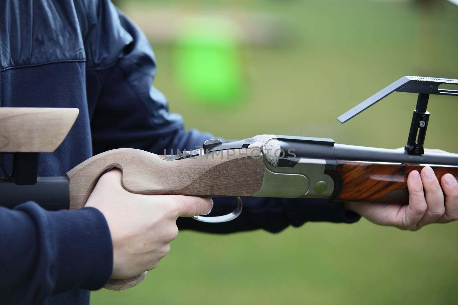 powerful gun with wooden butt and black