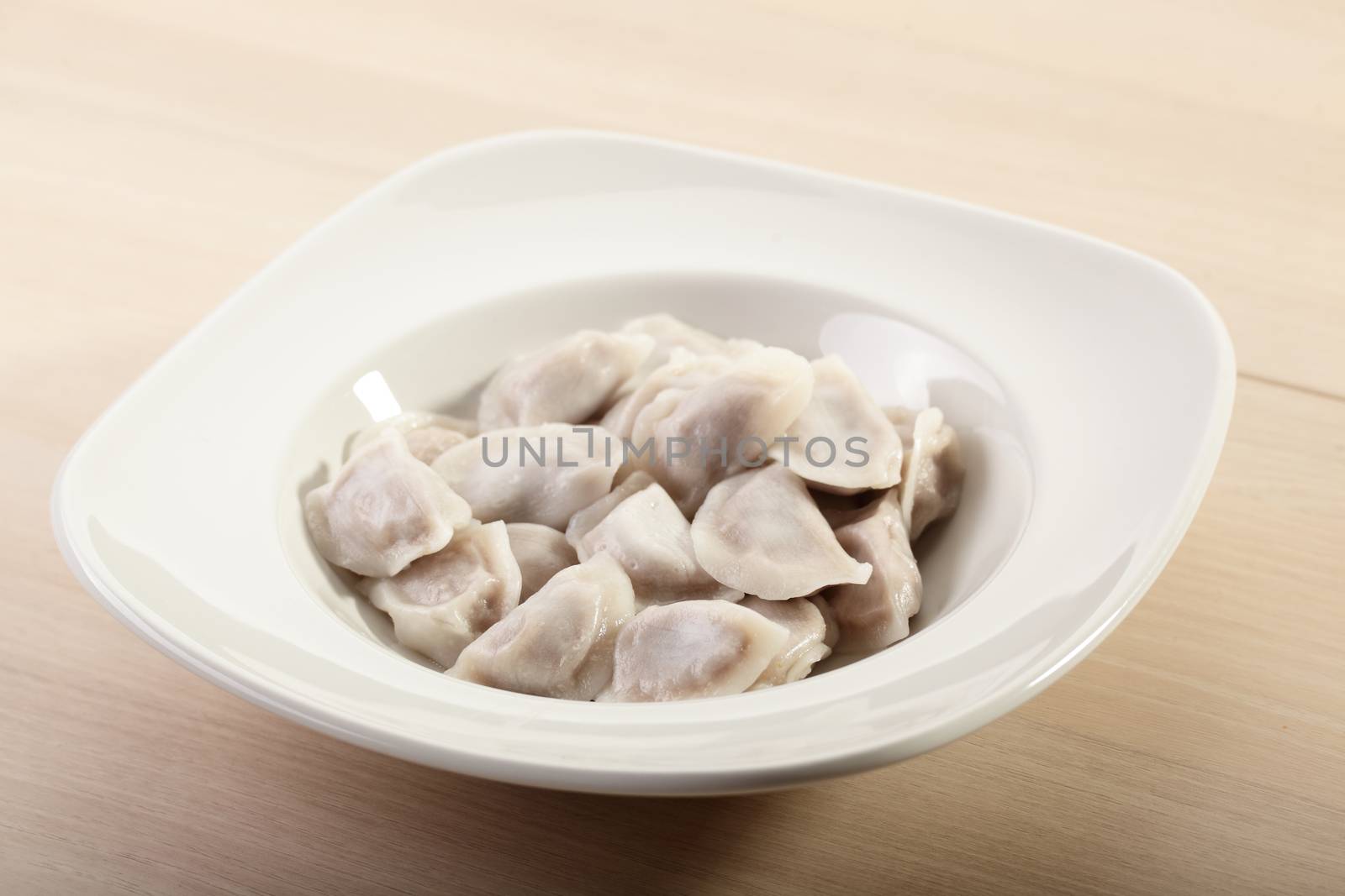 hot dumplings on the dish by fiphoto