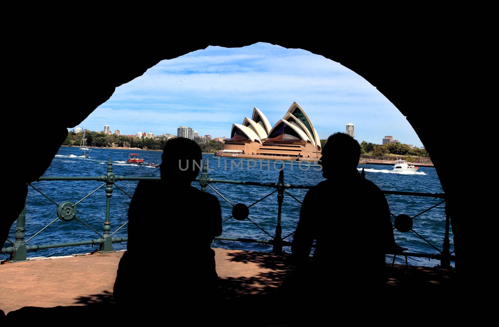 Silhouette of man and woman enjoying Sydney Harbour and Opera Ho by lovleah