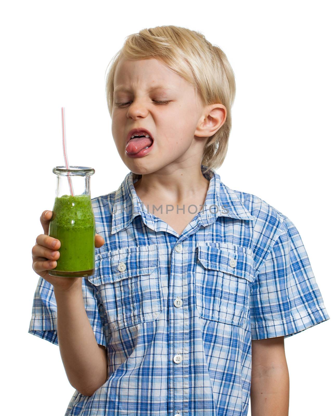 Boy poking tongue out at green smoothie by Jaykayl