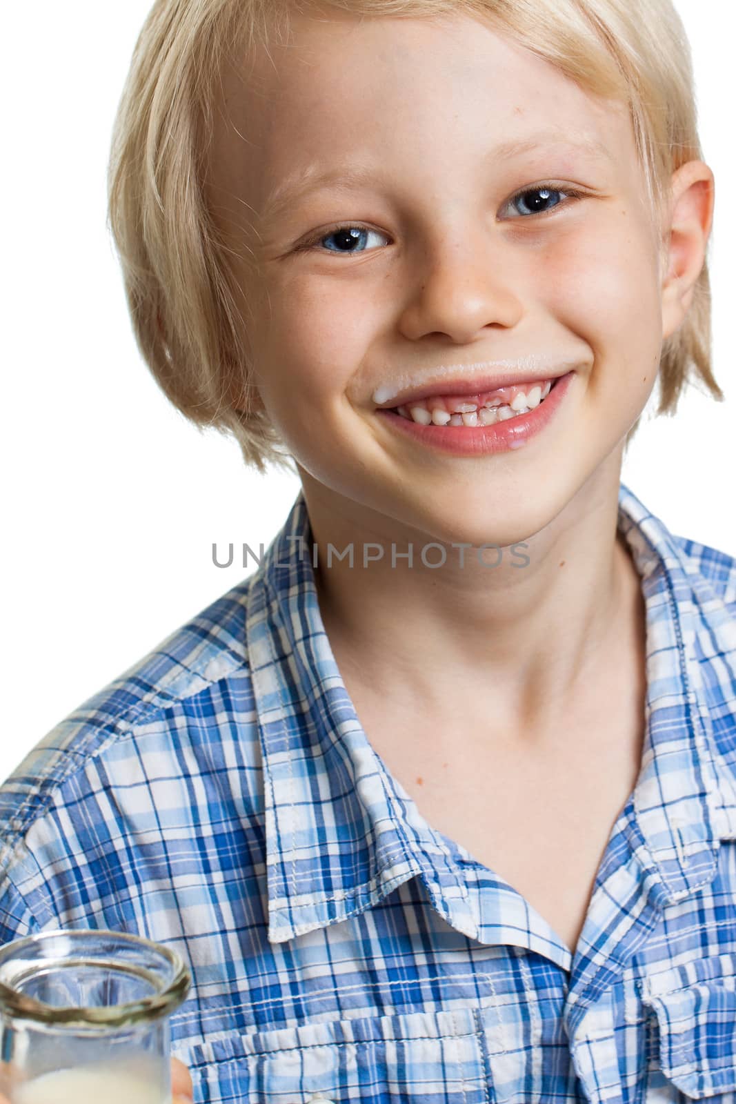 Close-up of a happy cute boy with milk moustache. Isolated on white.