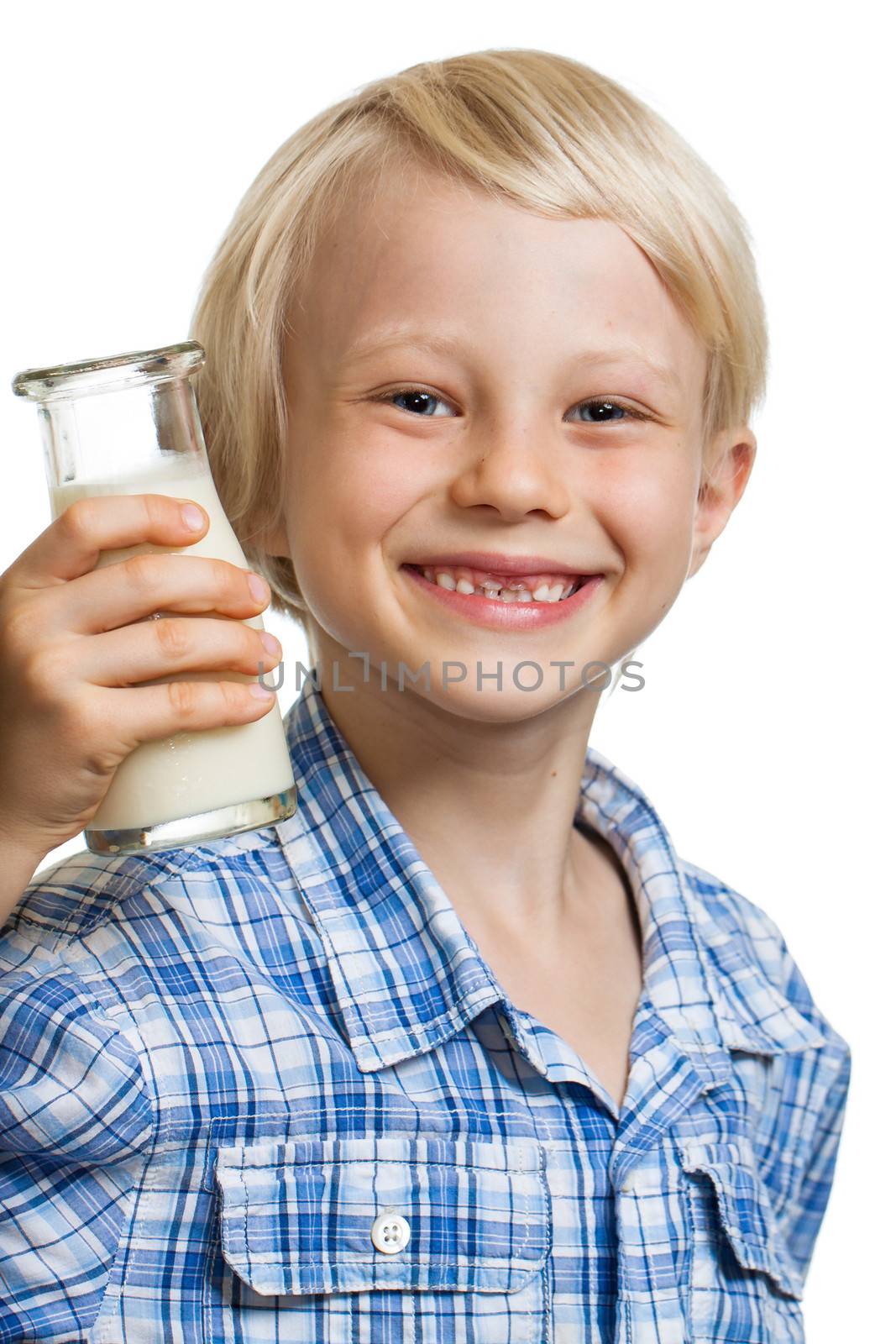 Happy cute boy with a bottle of milk. Isolated on white.