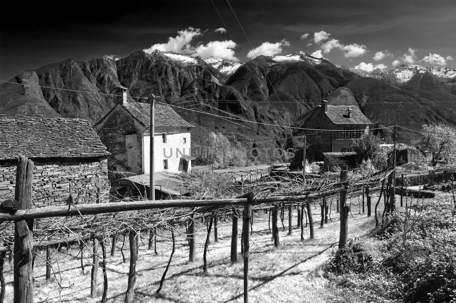 infrared b&w image of an alpine village, Domodossola, Italy