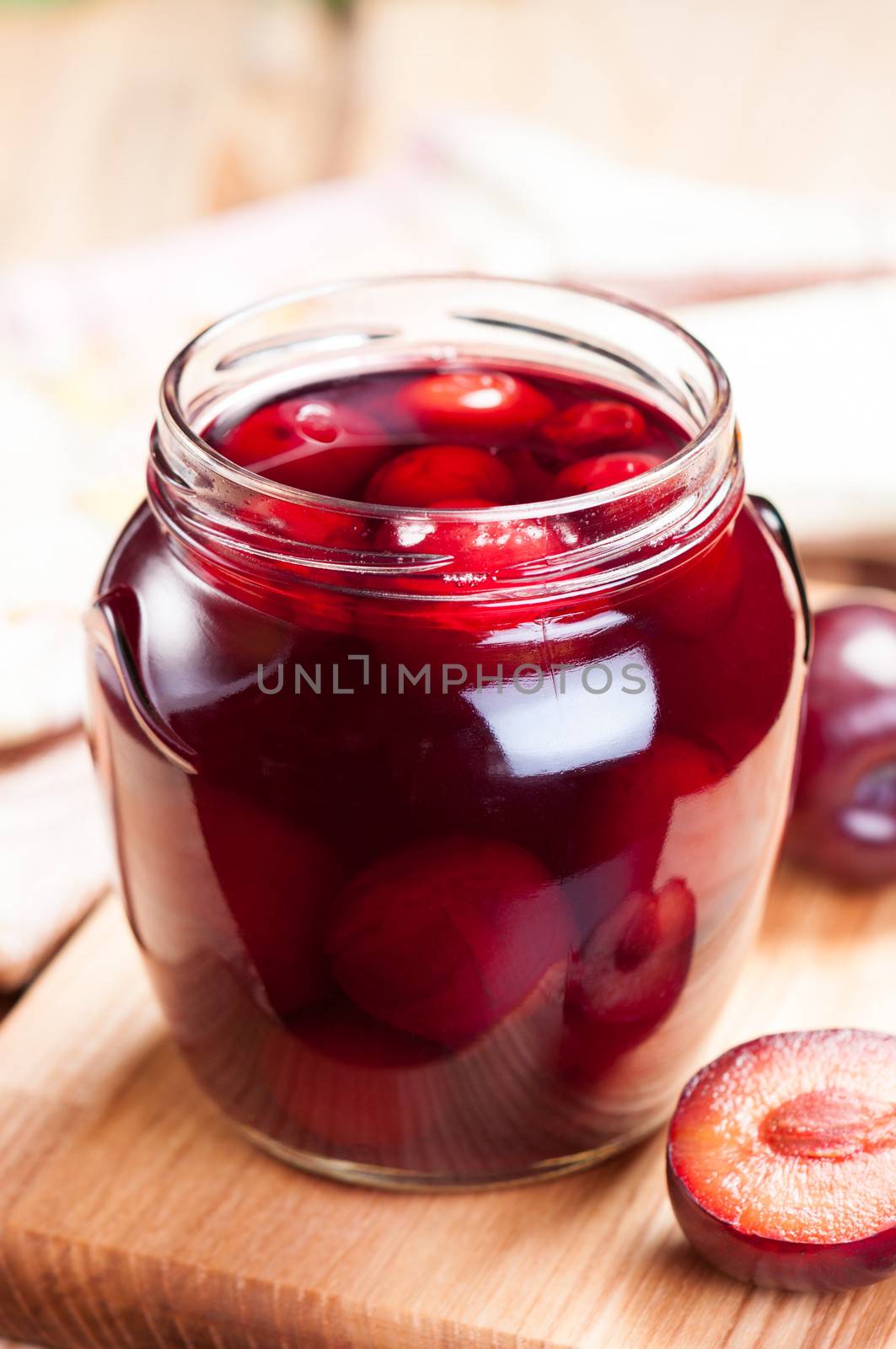 Plum compote in jar close up. by BPhoto