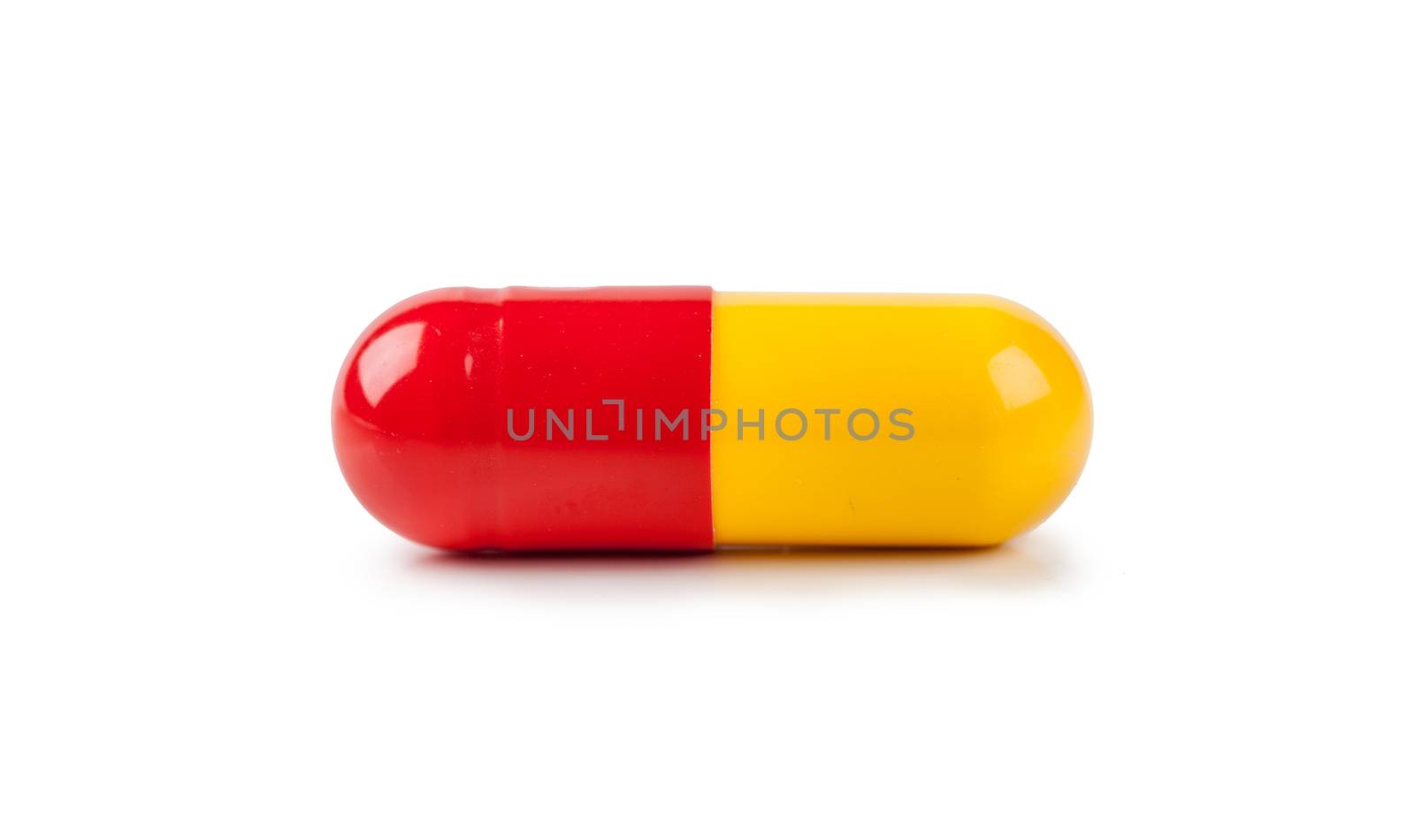 Macro view of capsule pill isolated over white background