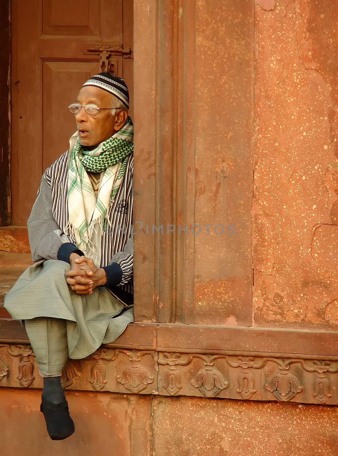 Indian man sitting at Jama Masjid, Delhi, India