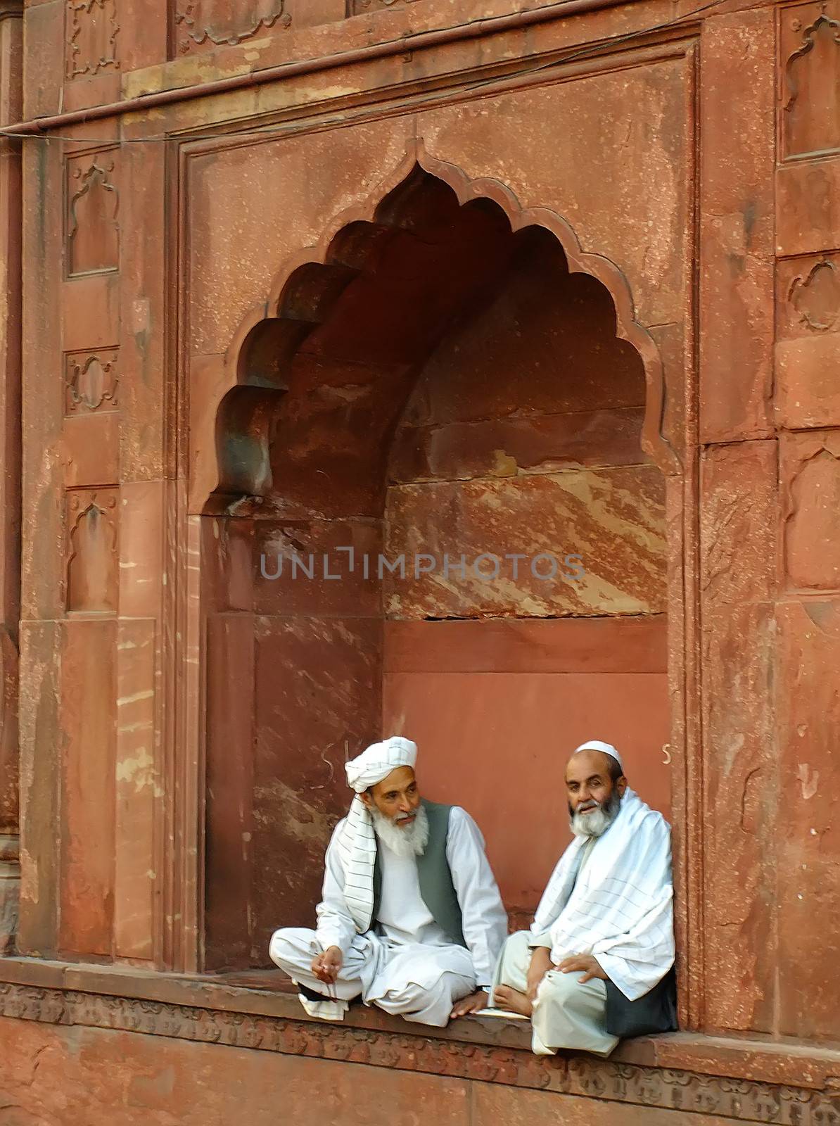 Two indian man sitting at Jama Masjid, Delhi, India