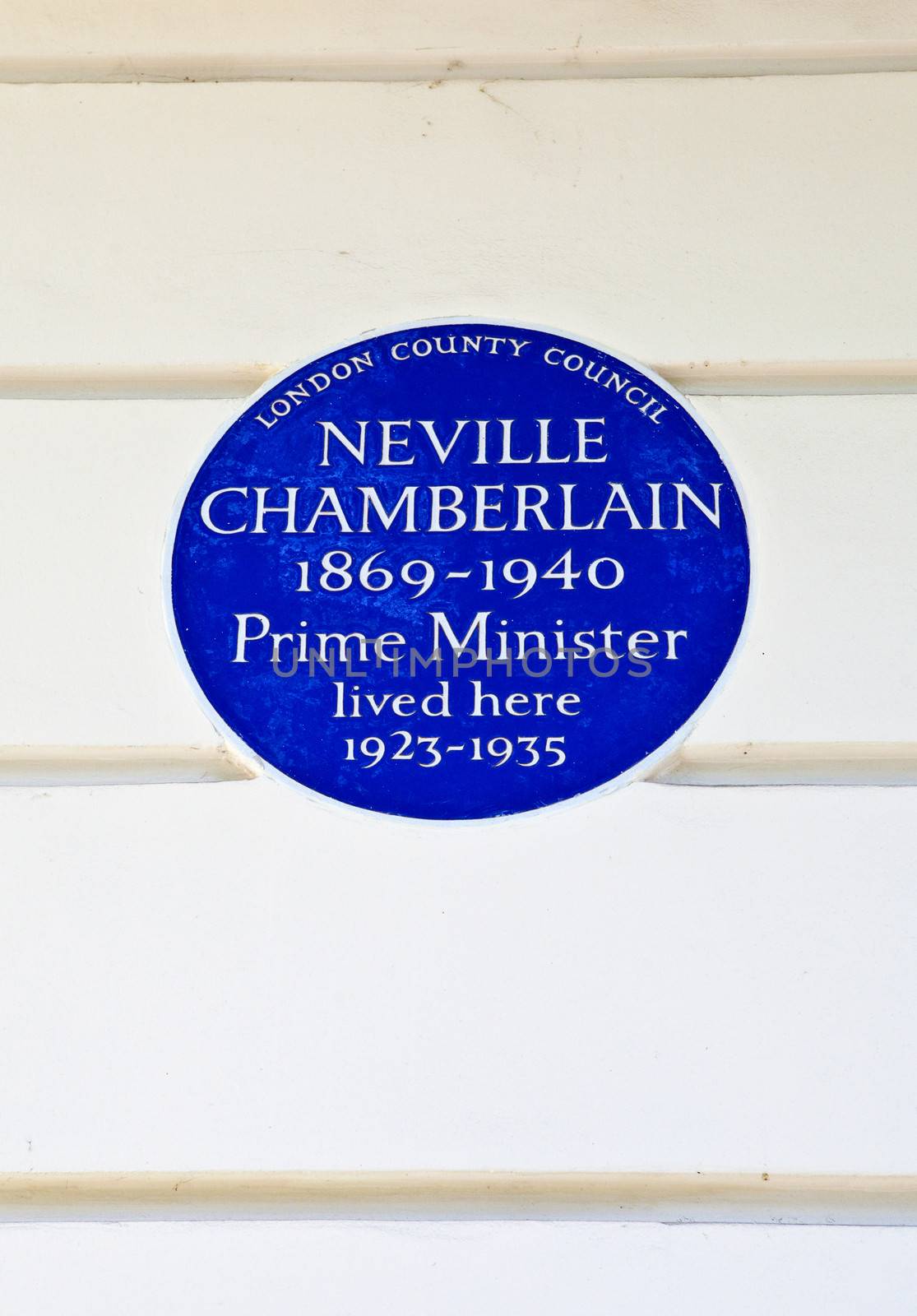 Blue plaque marking the former residence of Neville Chamberlain - a former Prime Minister.