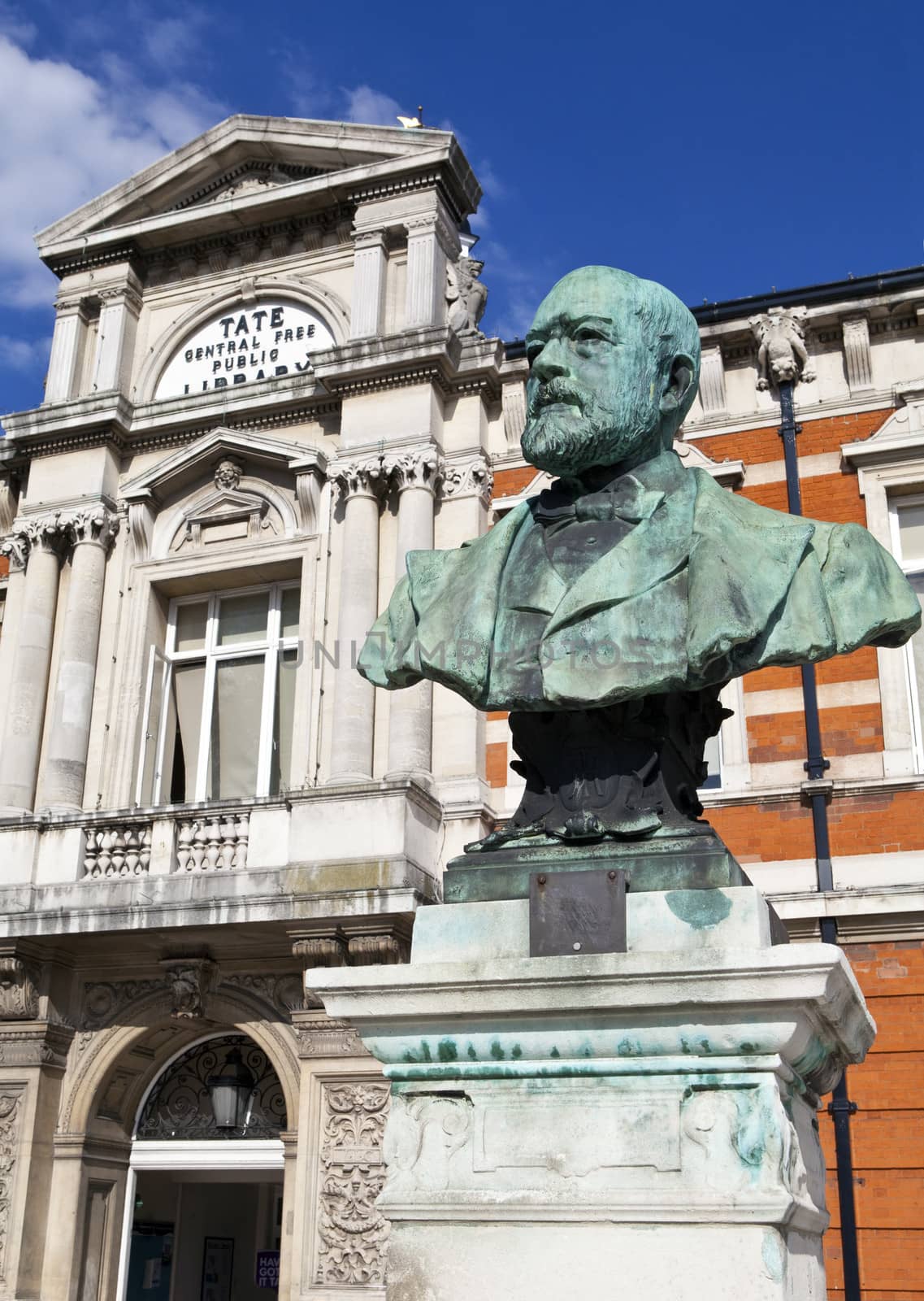A bust dedicated to Sir Henry Tate situated outside the Tat Public Library in Brixton, London.