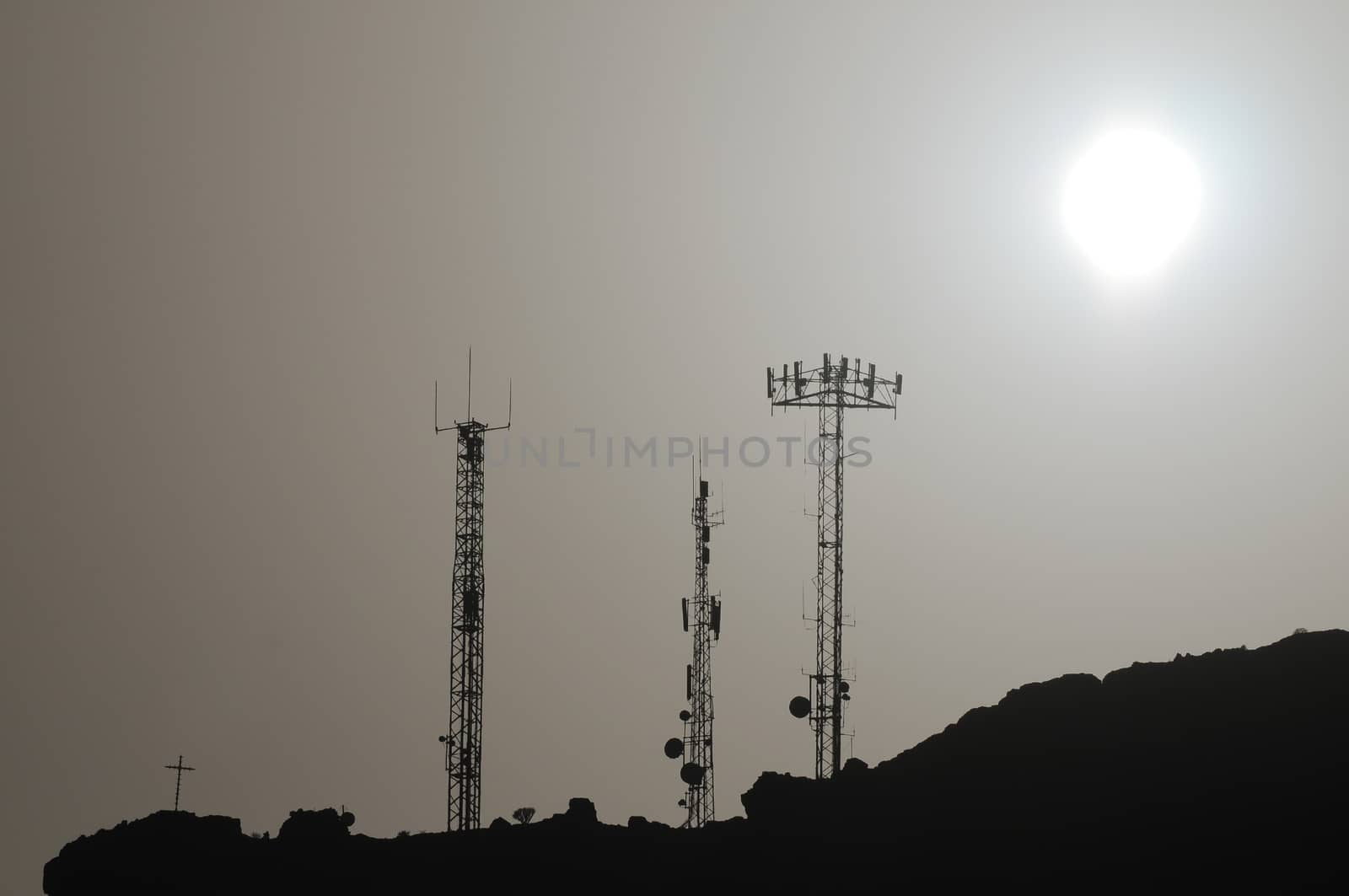 Some Silhouetted Antennas on the top of a Hill