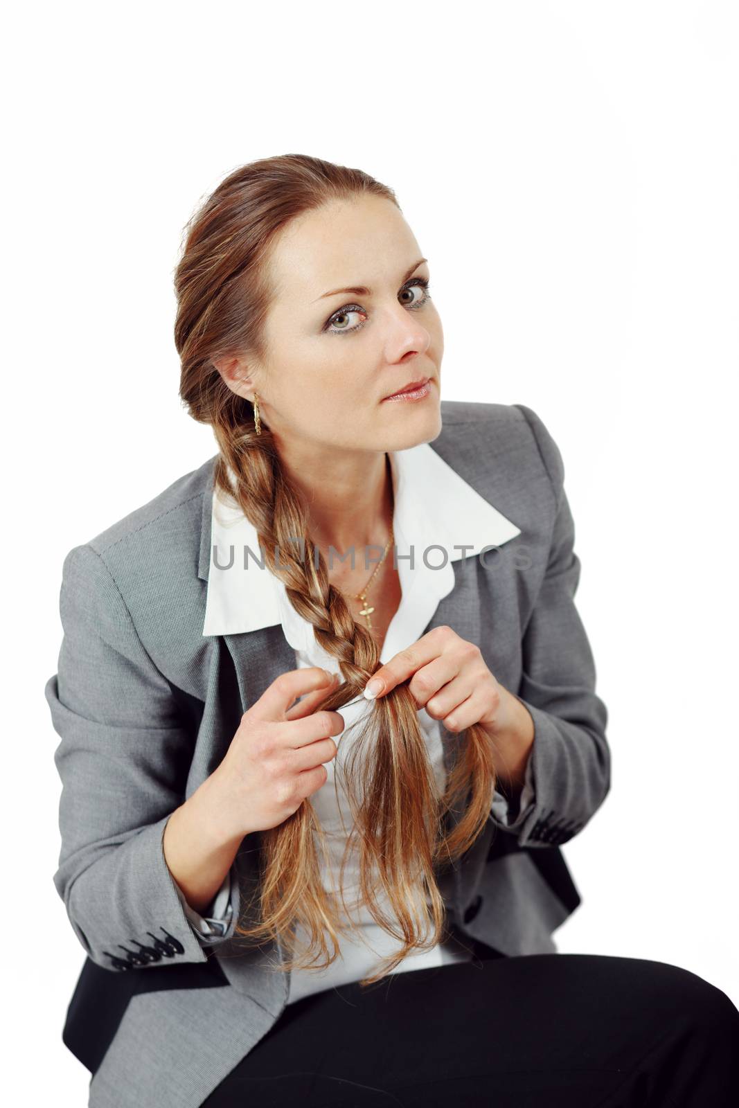 Middle age business woman with hands doing a braid a long mane on a isolated background