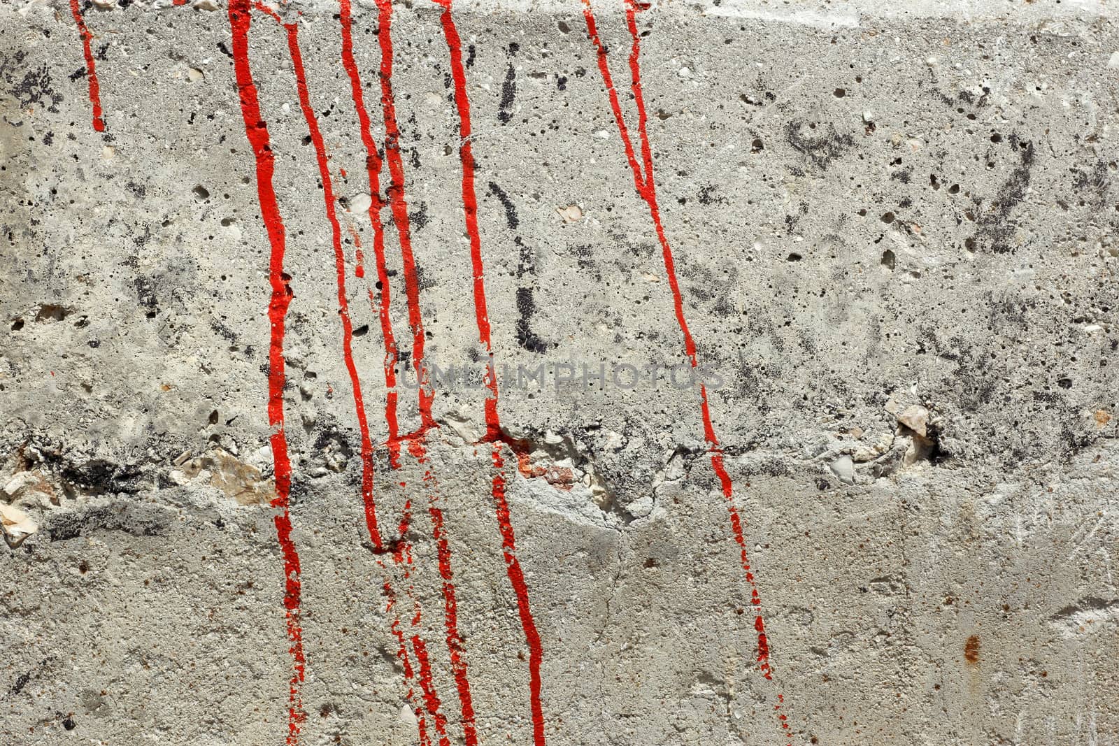 Streaks of red paint on a concrete wall by qiiip