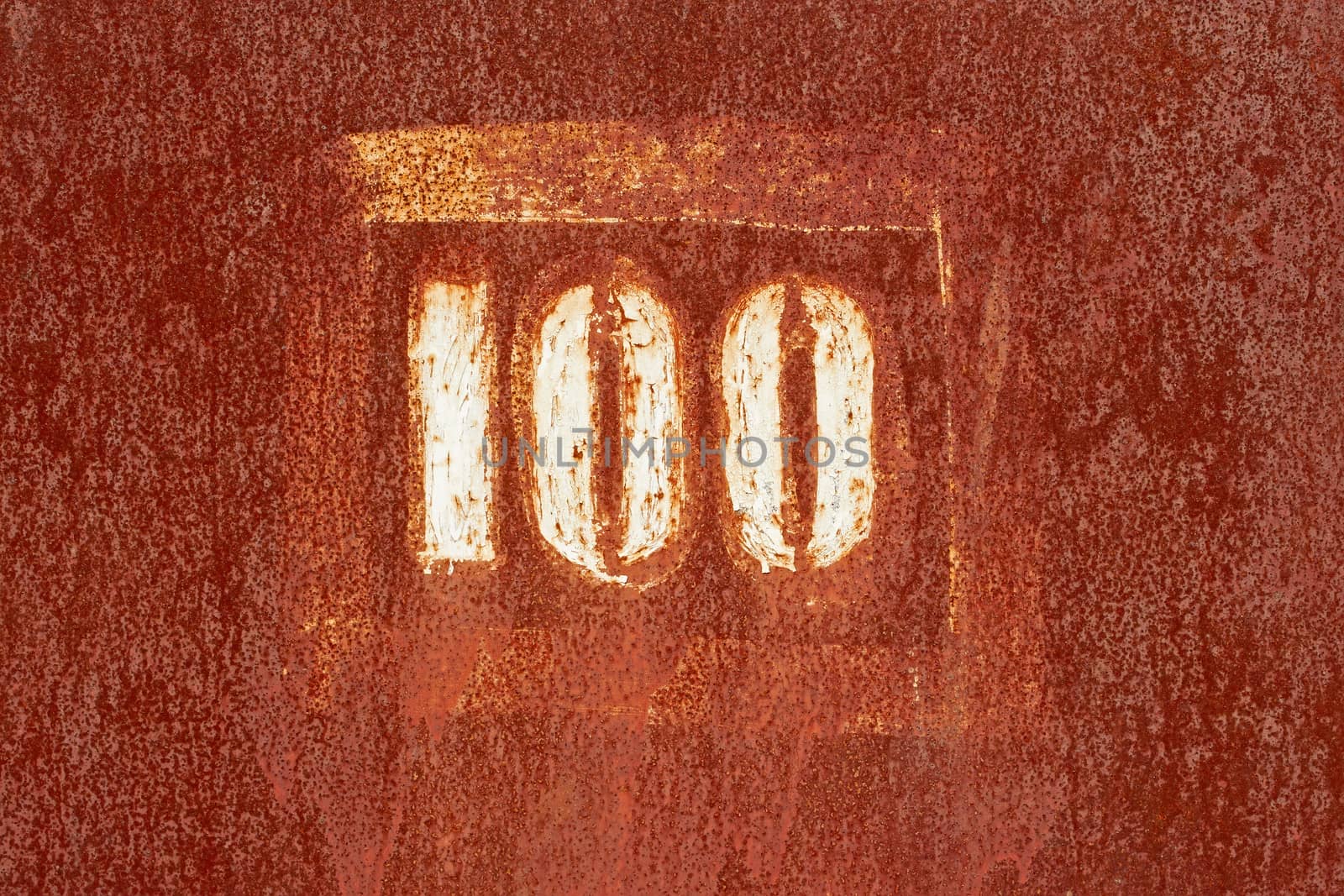 Number 100 painted on an old rusty surface by qiiip