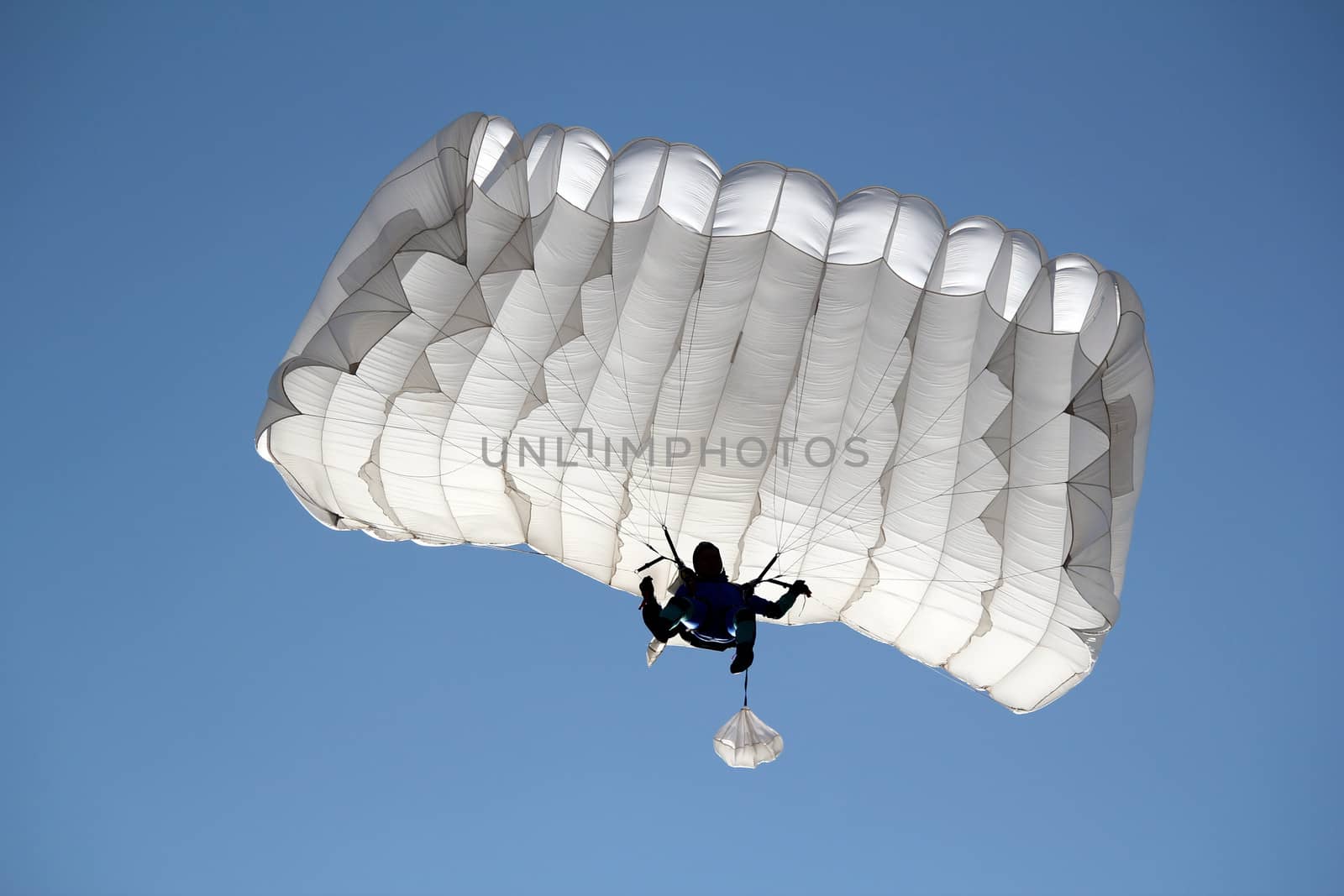 parachutist on blue sky extreme sport 