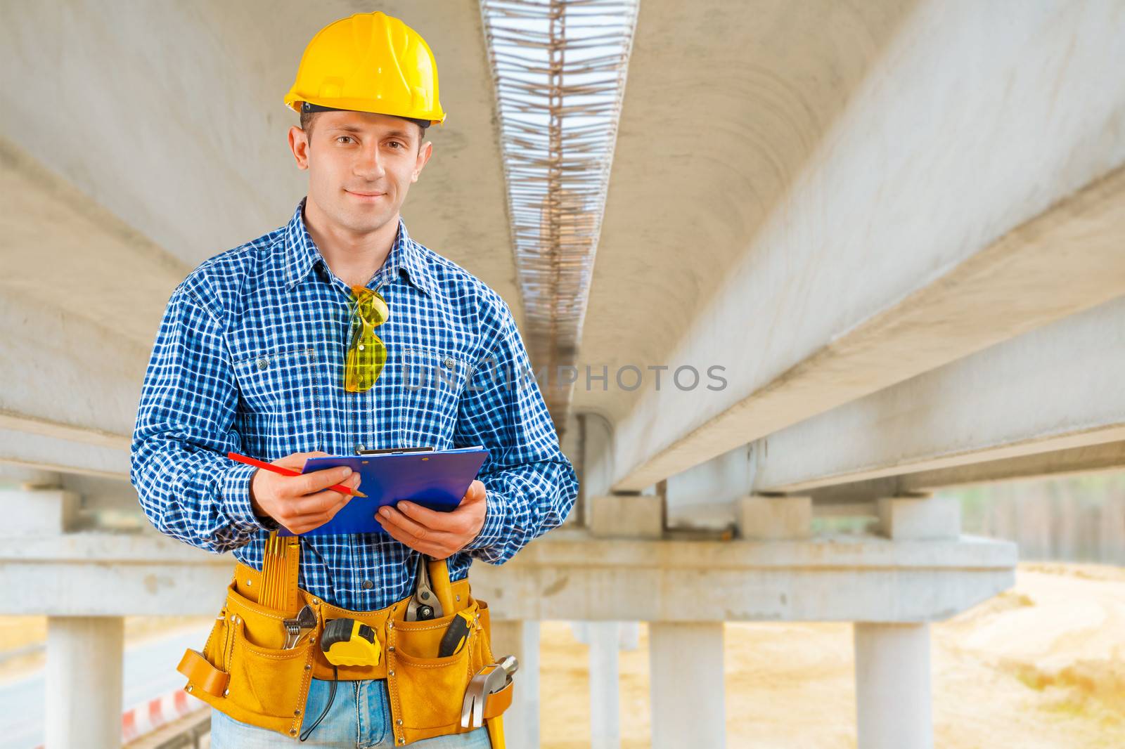 a contractor under the bridge under construction