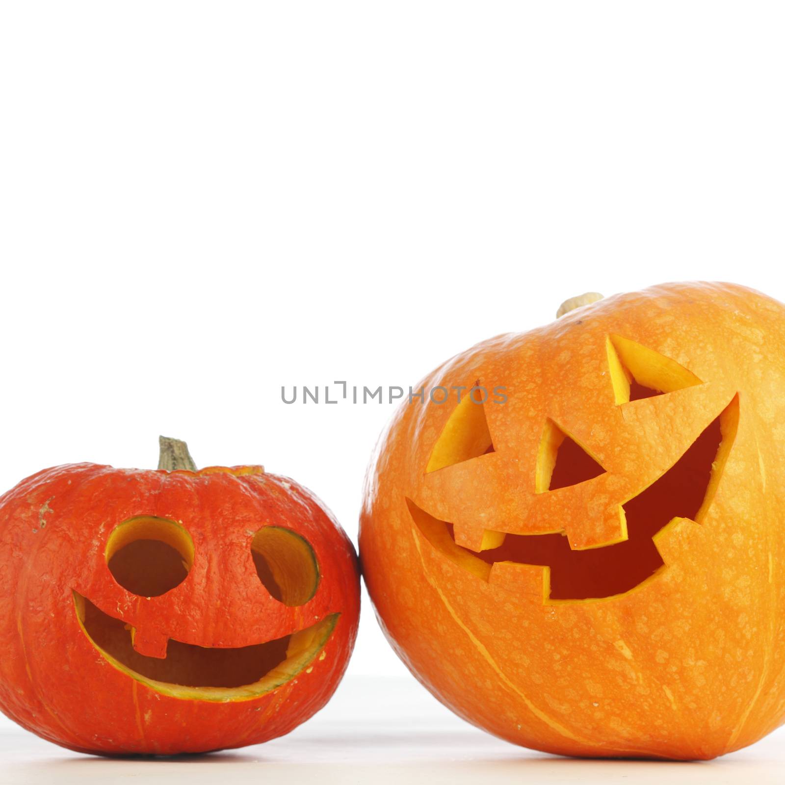 Two funny Halloween pumpkins on white background