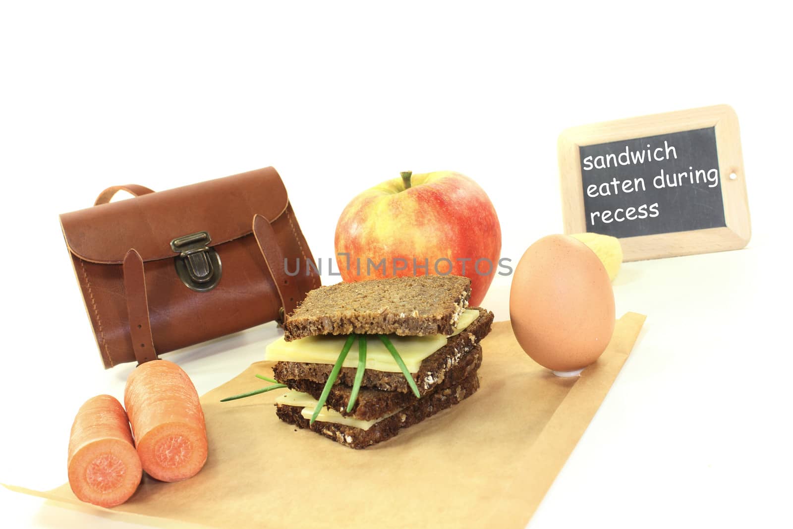 sandwich eaten during recess with apple on a bright background