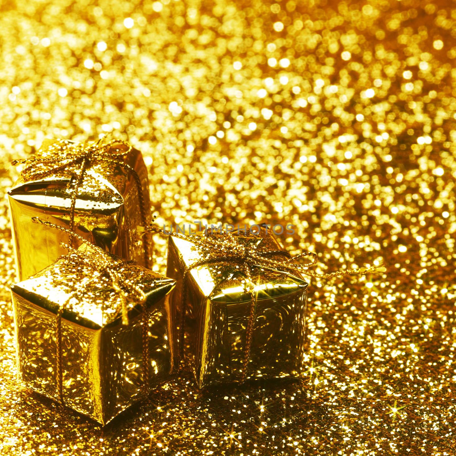 Christmas gift boxes on shiny background close-up