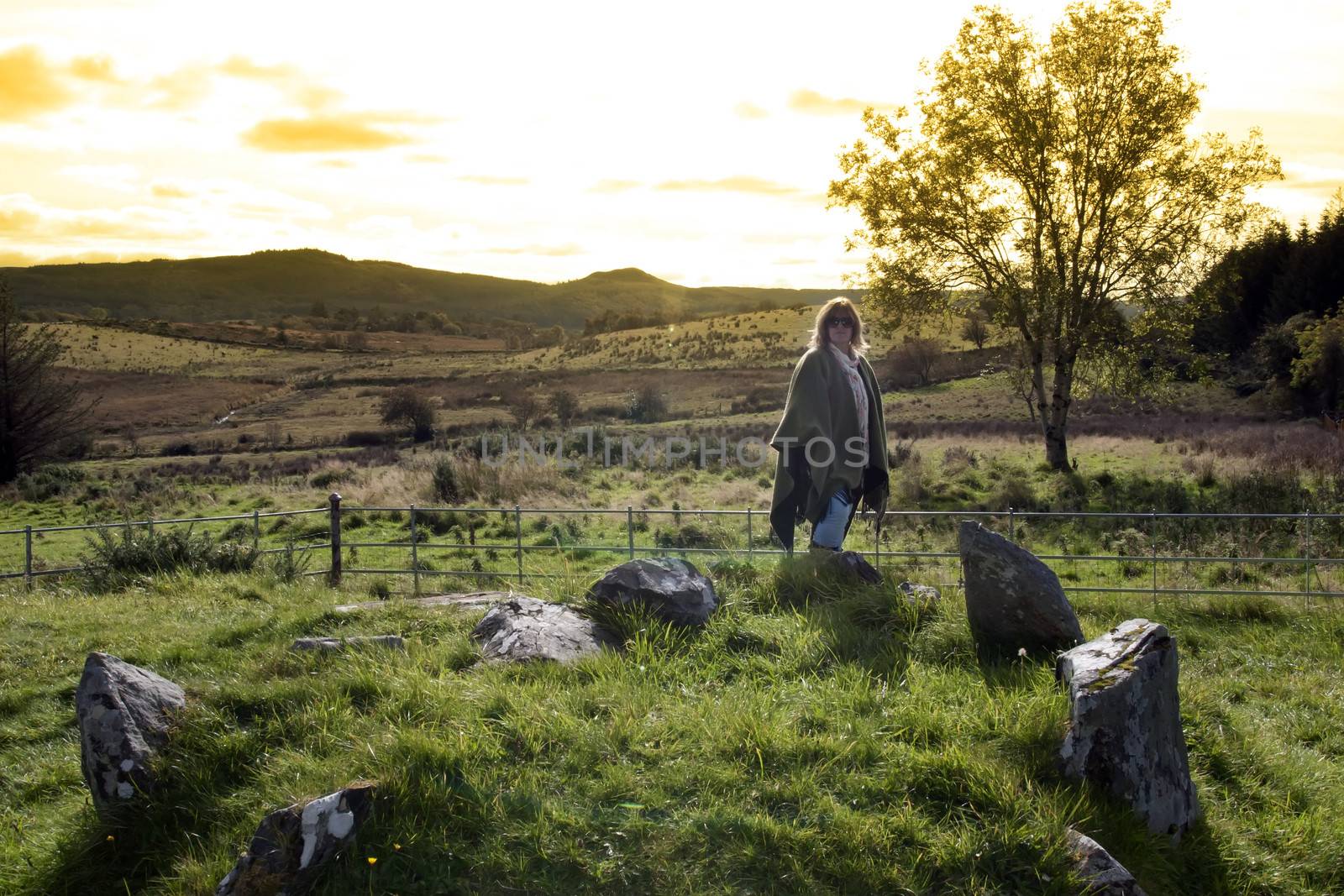 a female tourist at a stone circle in county Donegal Ireland