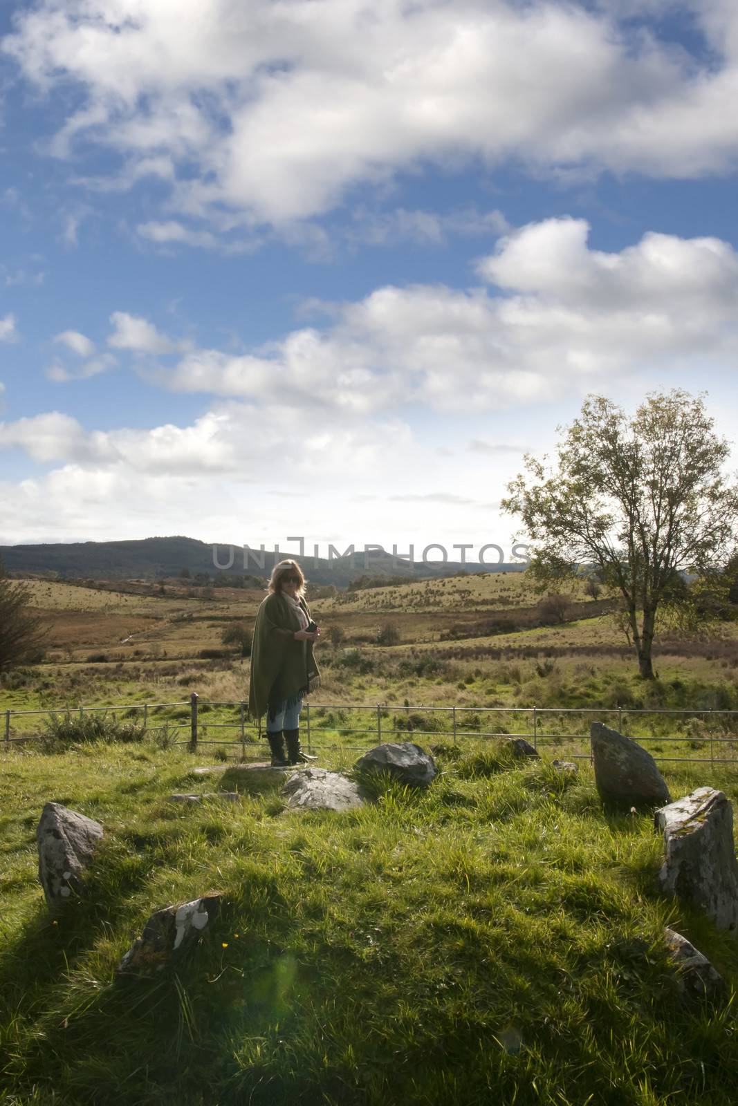 female tourist at a stone circle in county Donegal by morrbyte