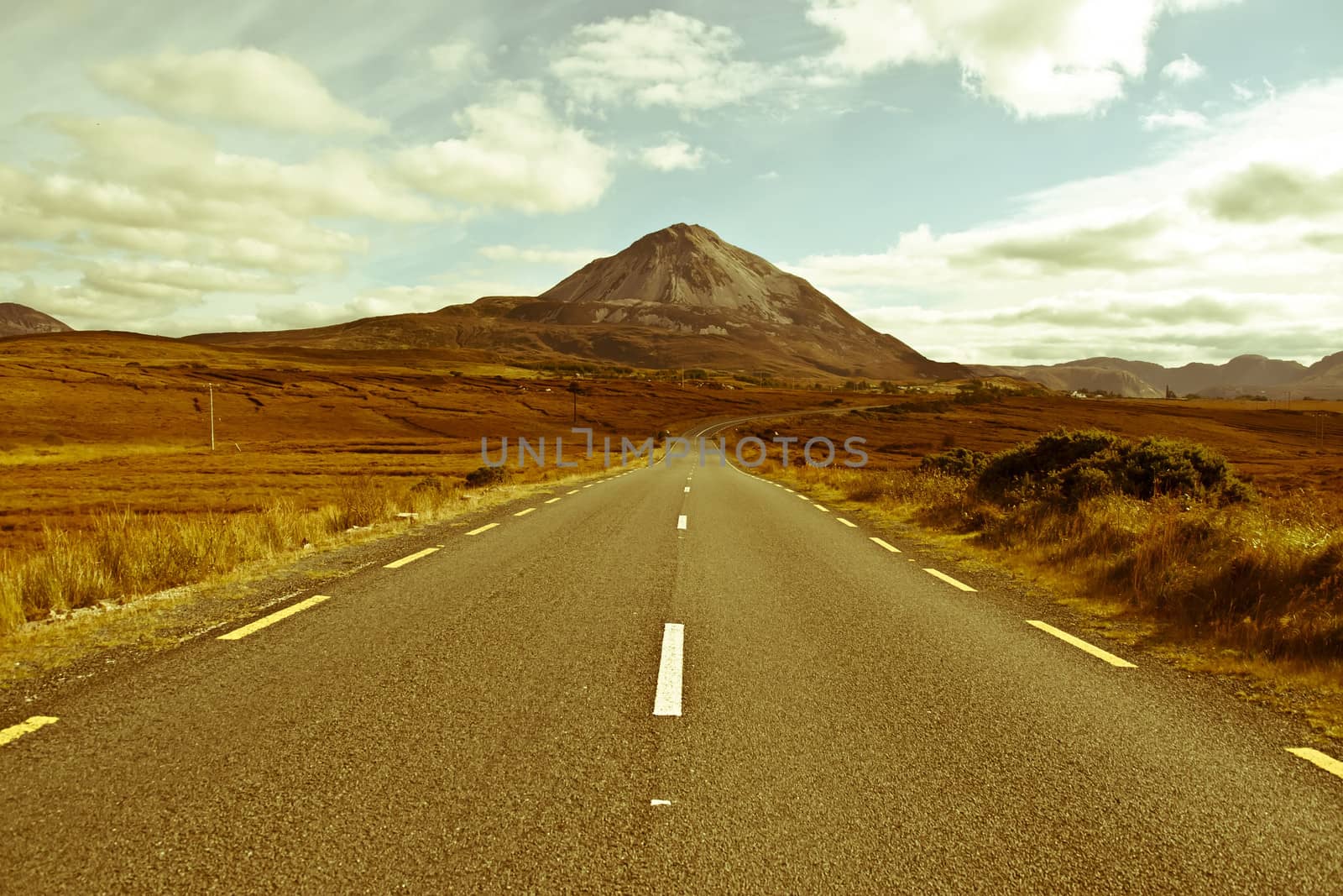 road to the Errigal mountains in county Donegal Ireland on a bright cloudy day