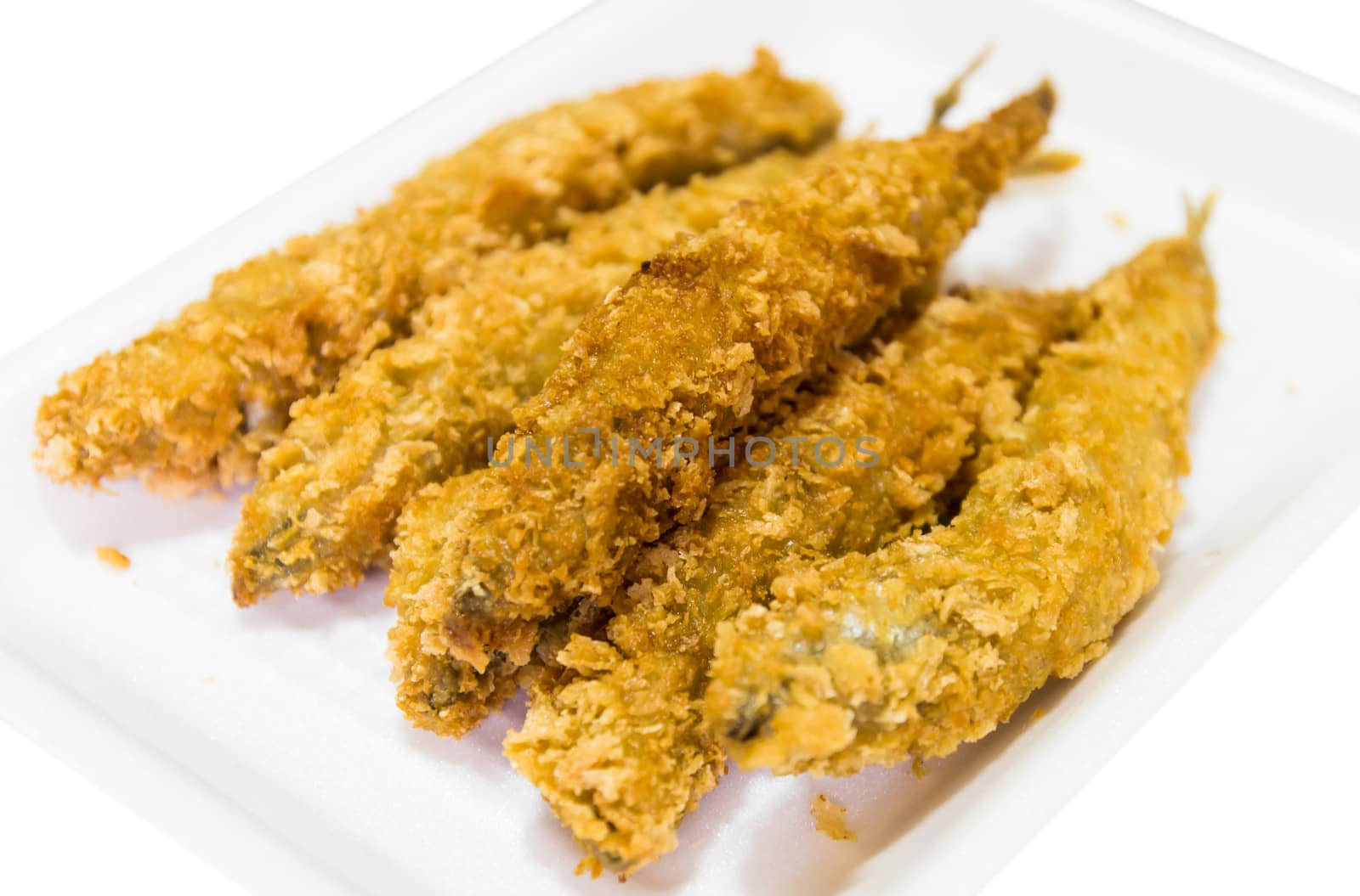 fried fish isolated on white background by photo2life