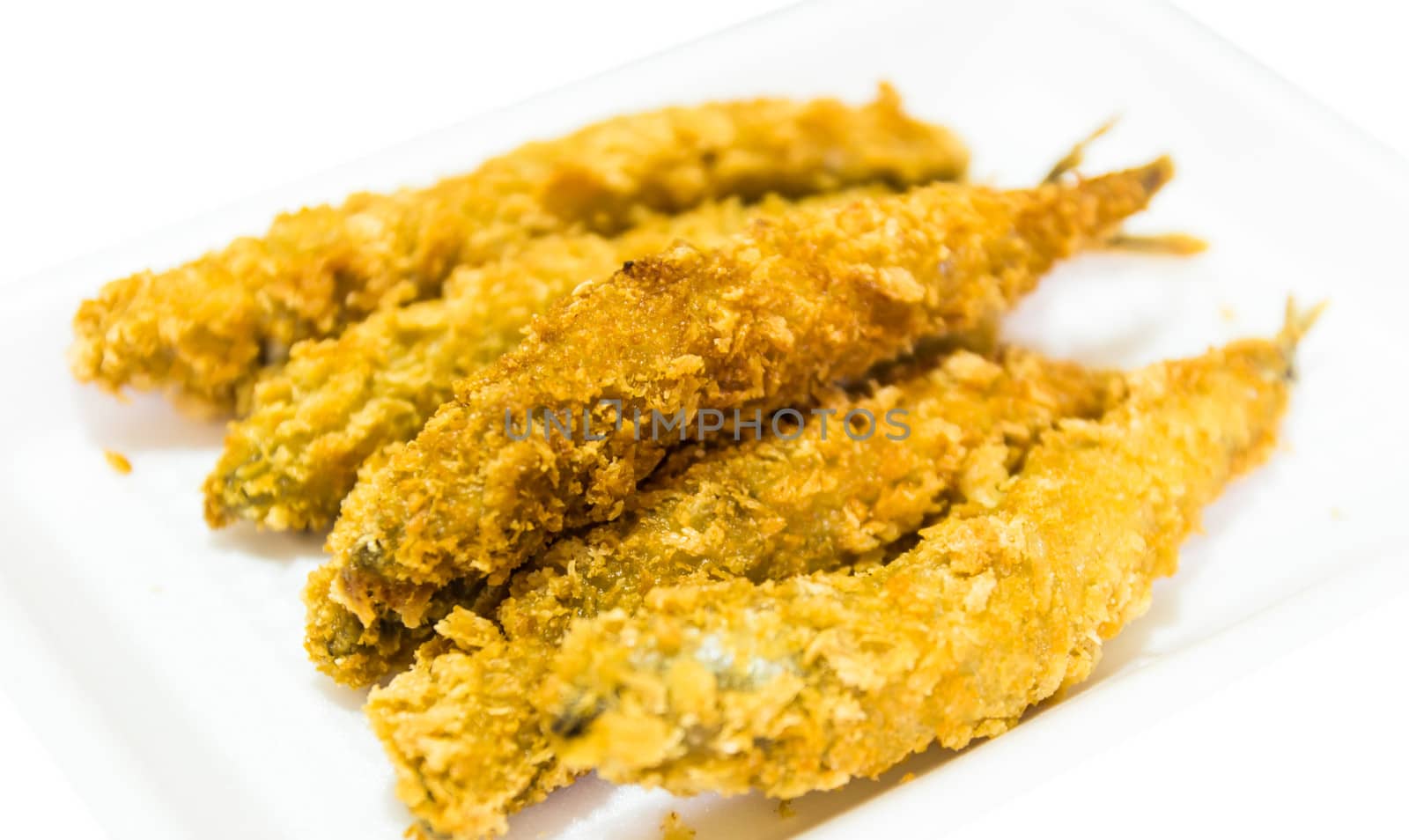 fried fish isolated on white background by photo2life