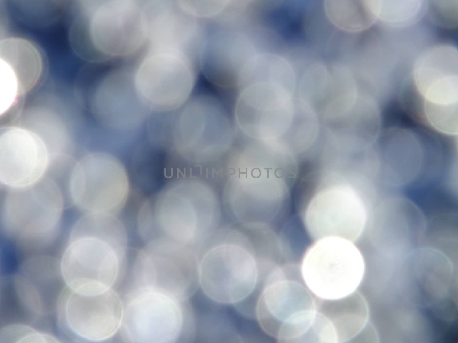 A gray blur in bokeh style - to be used as background