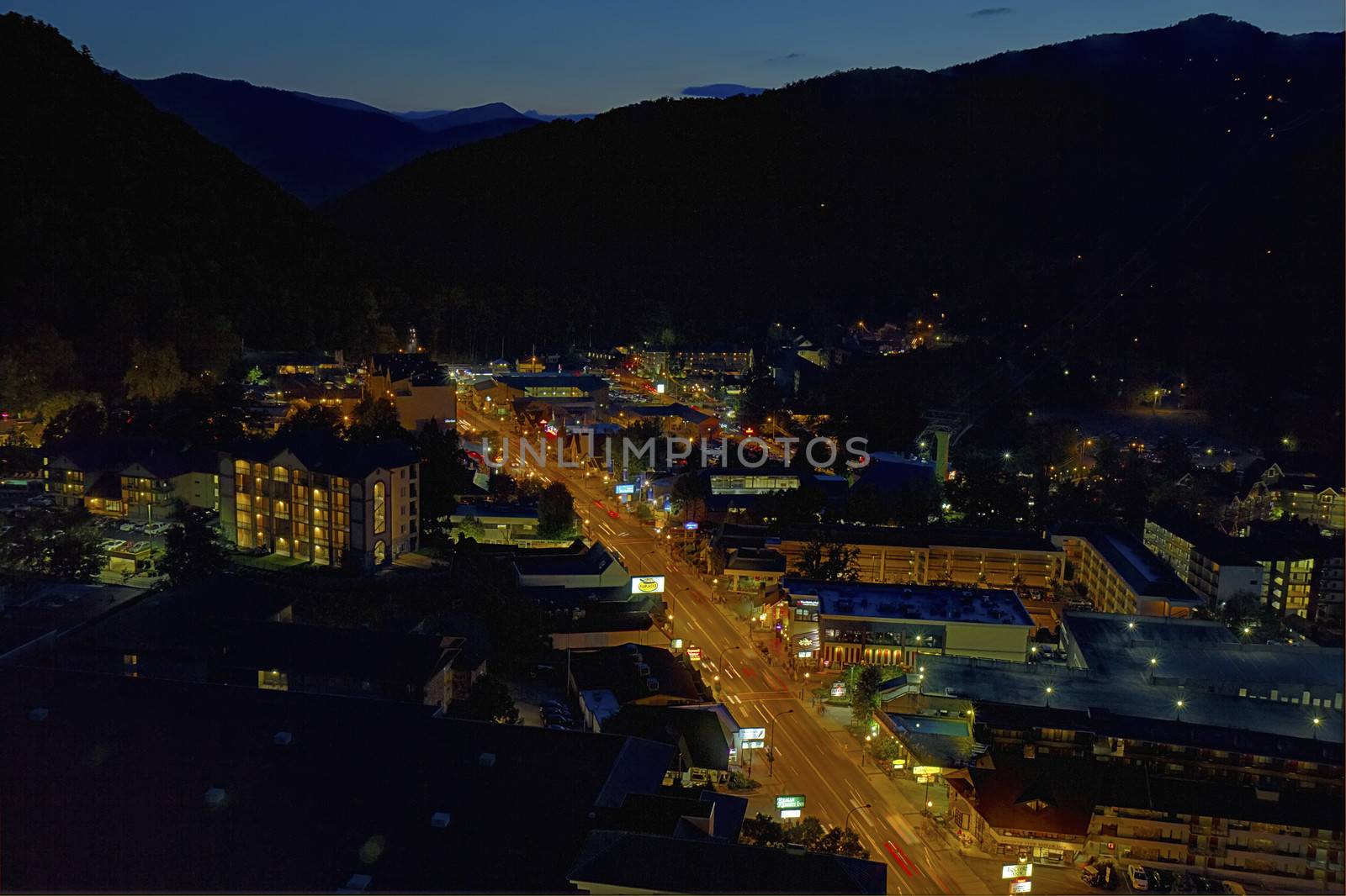 GATLINBURG, TENNESSEE - OCTOBER 5: Aerial night view of Gatlinburg, Tennessee on October 5, 2013. Gatlinburg is a major tourist destination and gateway to the Great Smoky Mountains National Park.