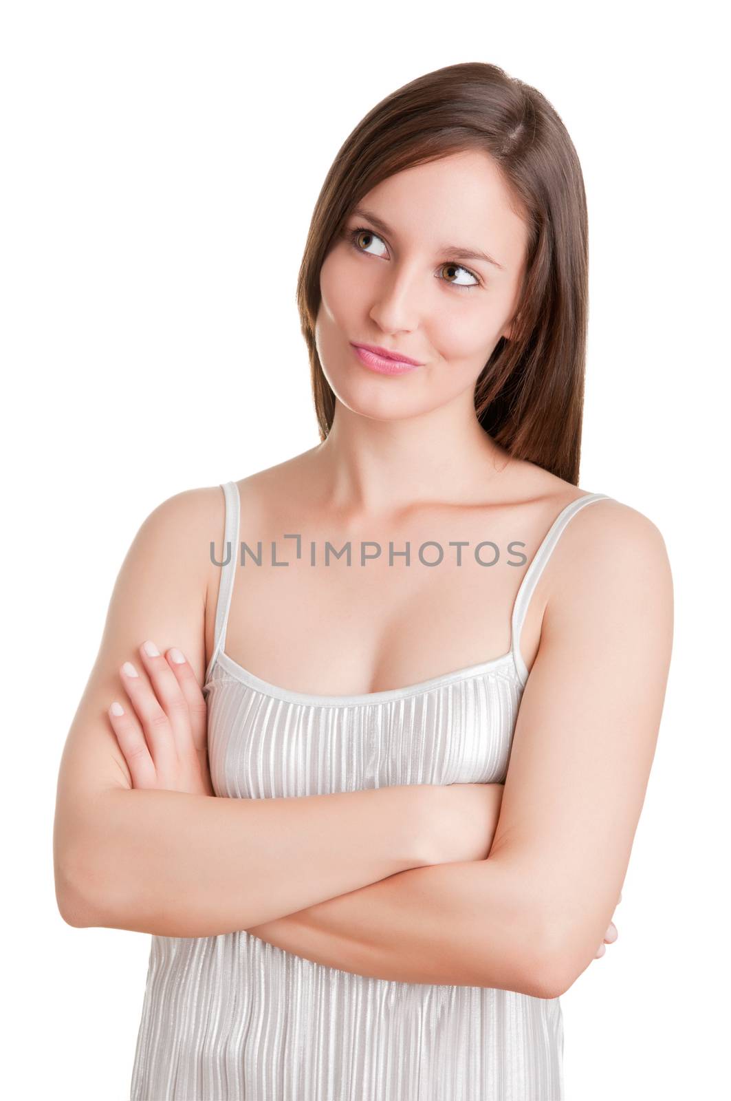 Portrait of a young woman with her arms crossed, isolated in white