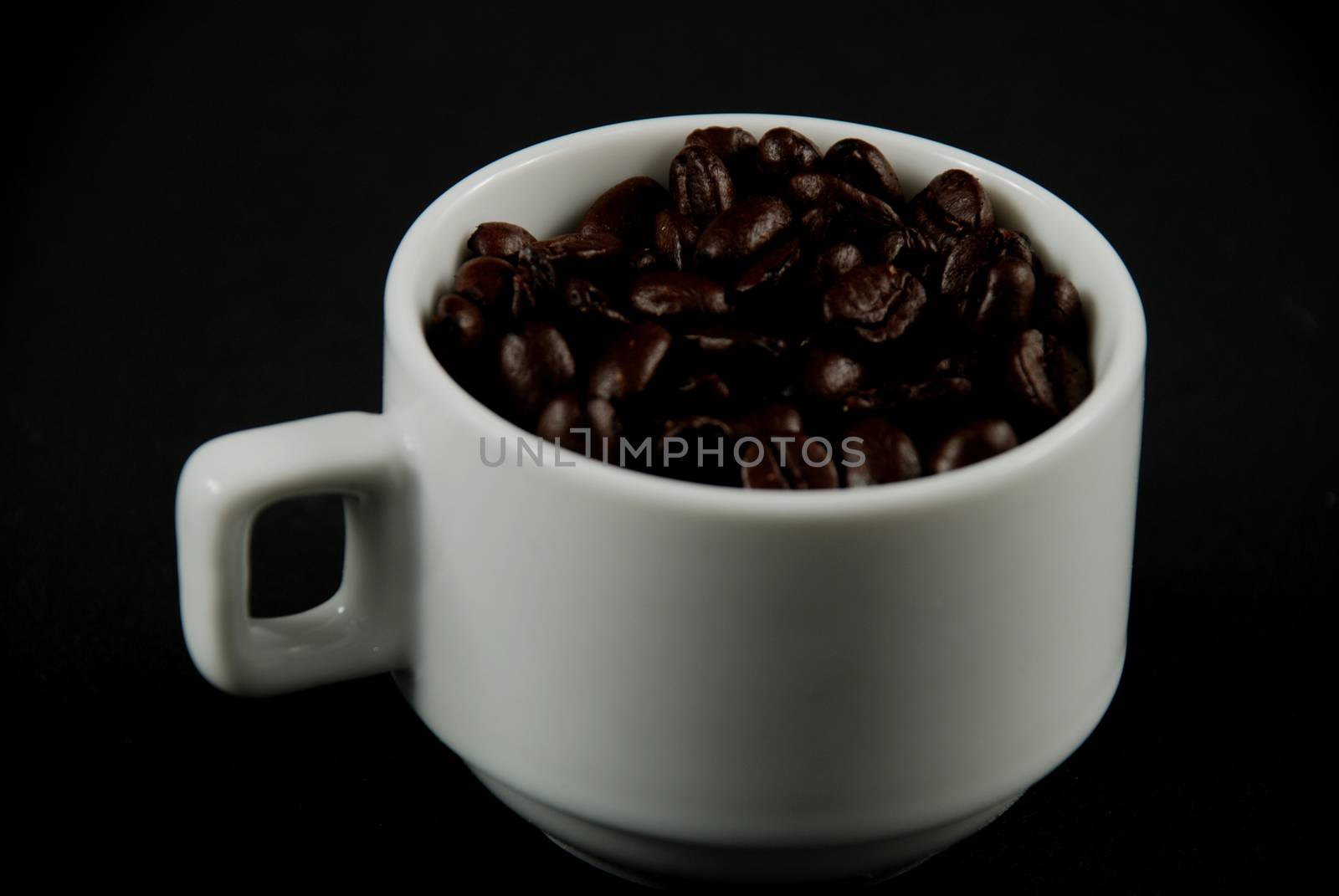 Coffee beans and cup by albln