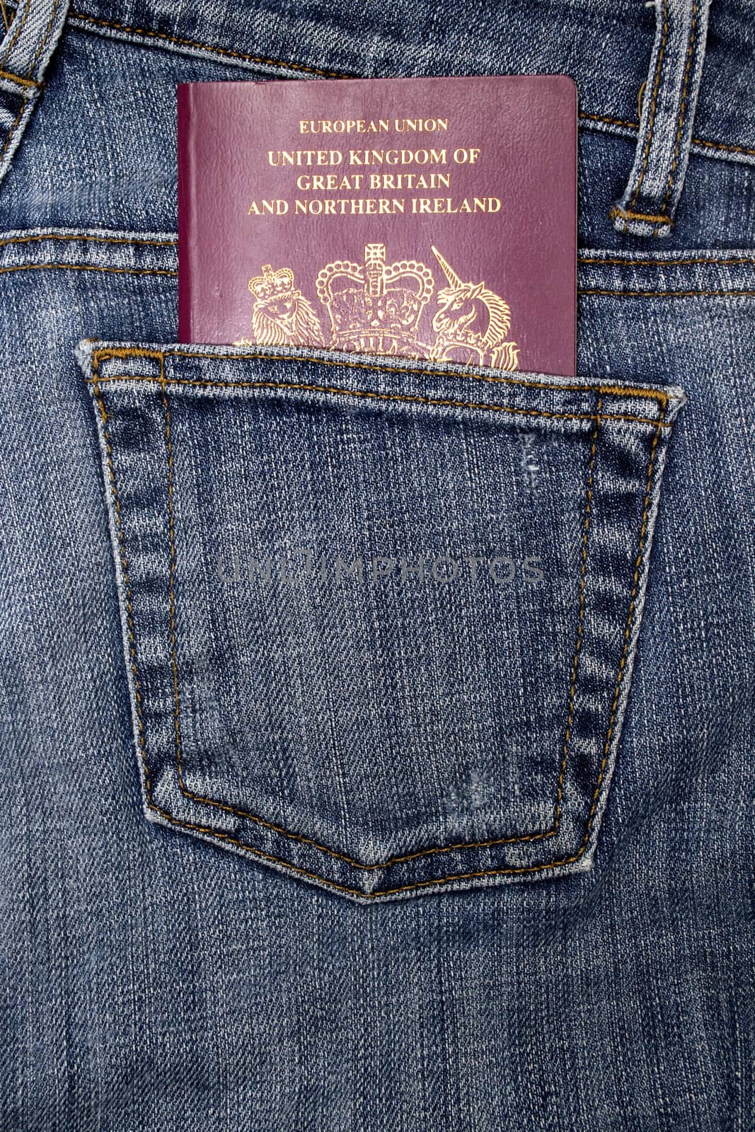 British passport in a denim jeans pocket
