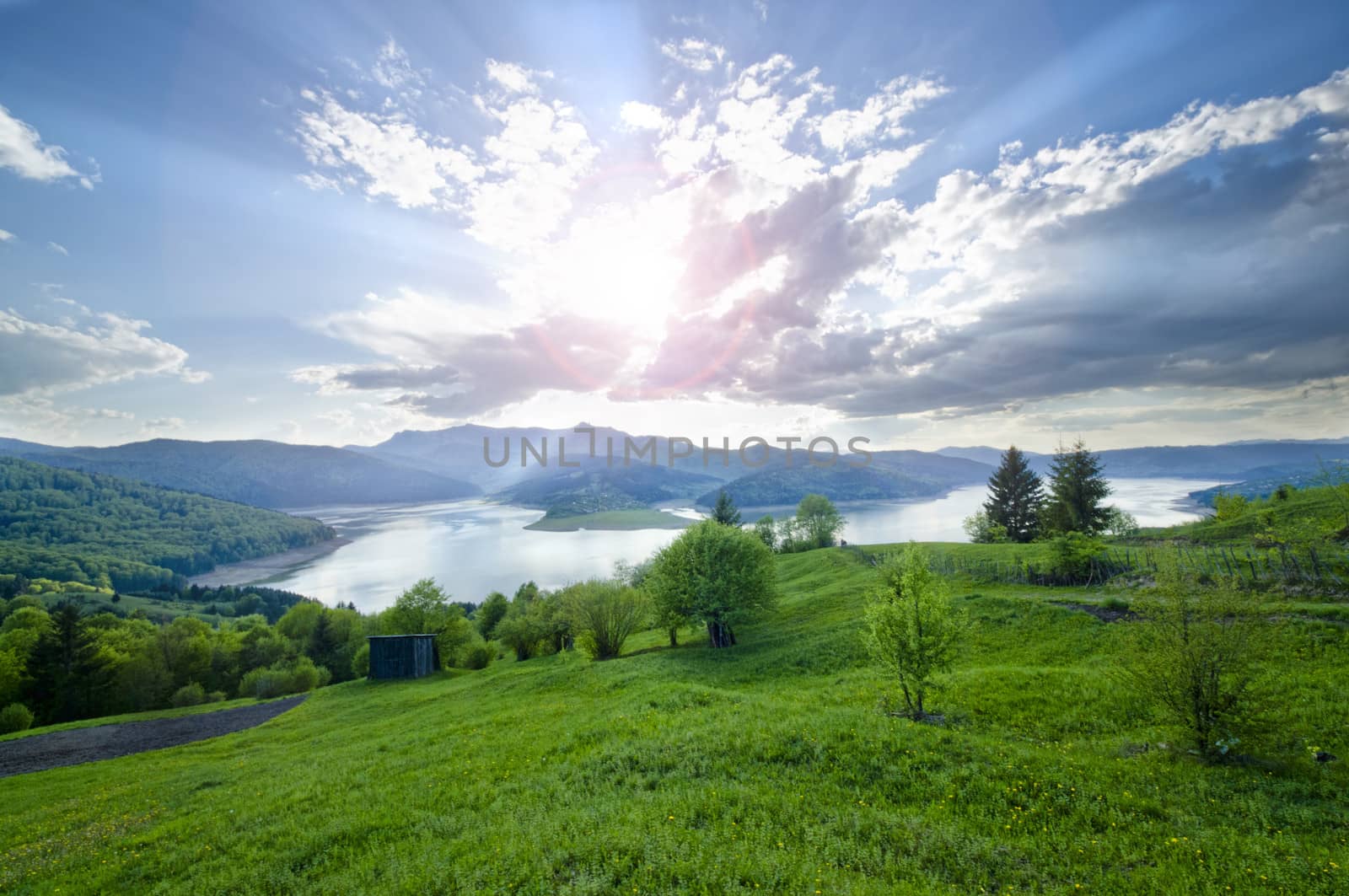 Rural scene of mountain and lake at summer, Romanian Carpathians