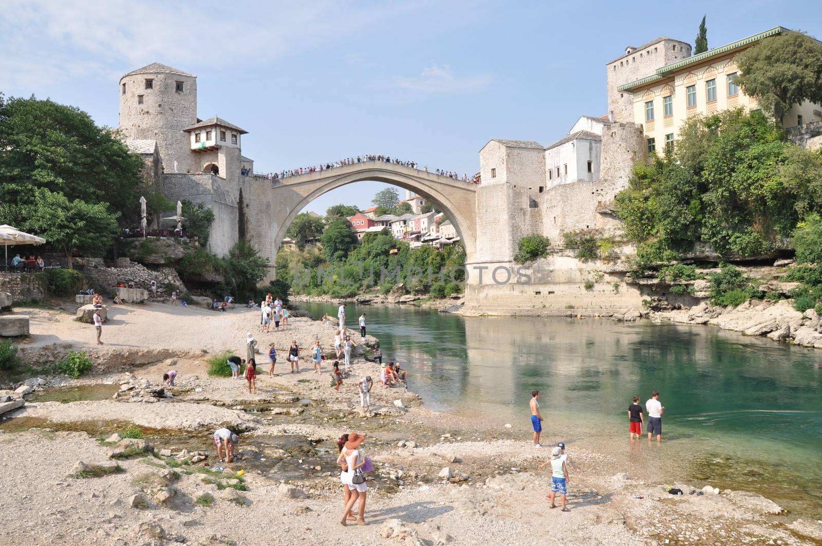 MOSTAR, BOSNIA-HERCEGOVINA AUGUST 10: Tourist at the old bridge  by anderm