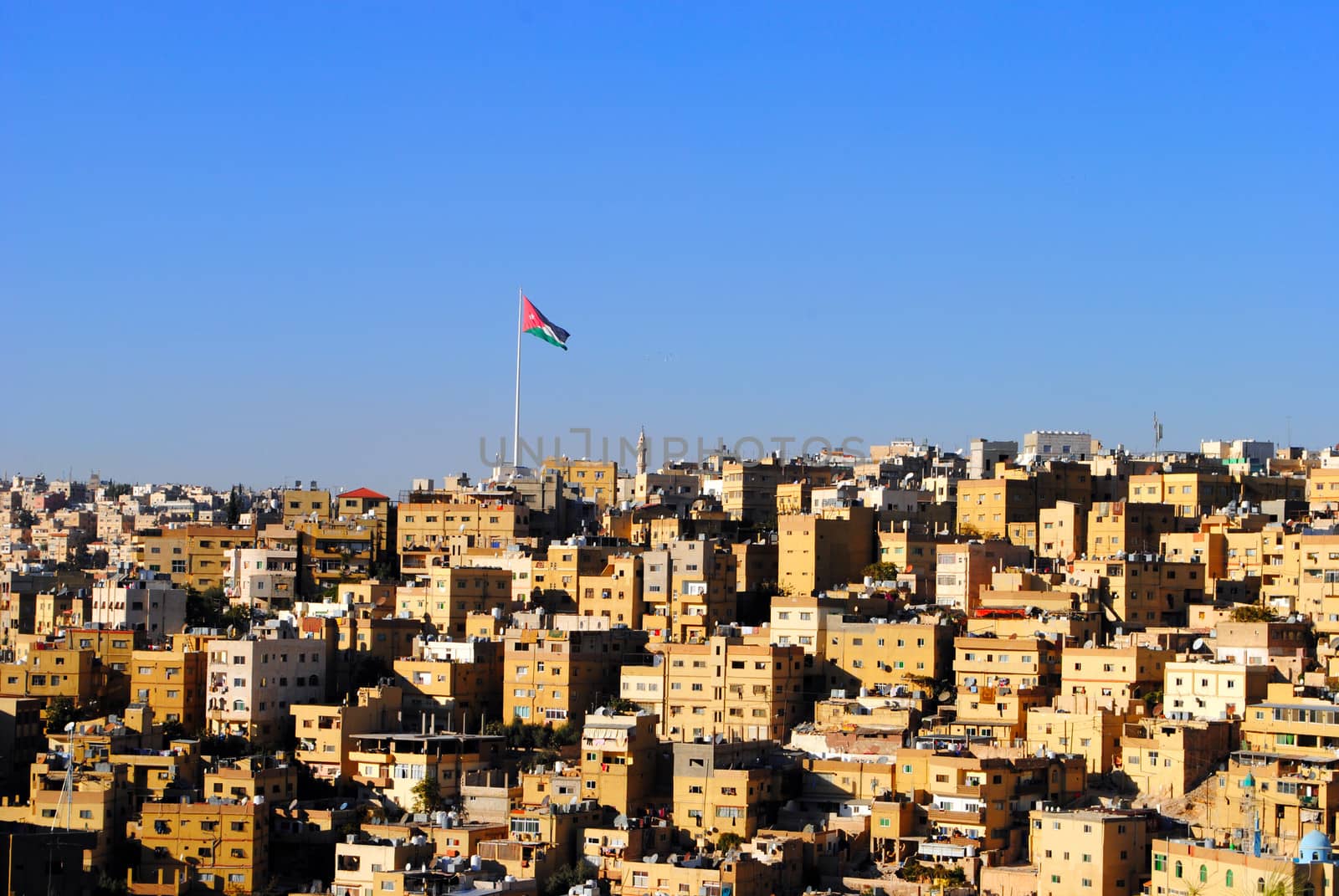 Amman (English pronunciation: /ɑːˈmɑːn/; Arabic: عمان‎ ʿAmmān ) is the capital and largest city of Jordan. It is the country's political, cultural and commercial centre and one of the oldest continuously inhabited cities in the world. The Greater Amman area has a population of 2,842,600. The recent economic growth experienced in Amman is unmatched by any other Arab city except those located in the Gulf.