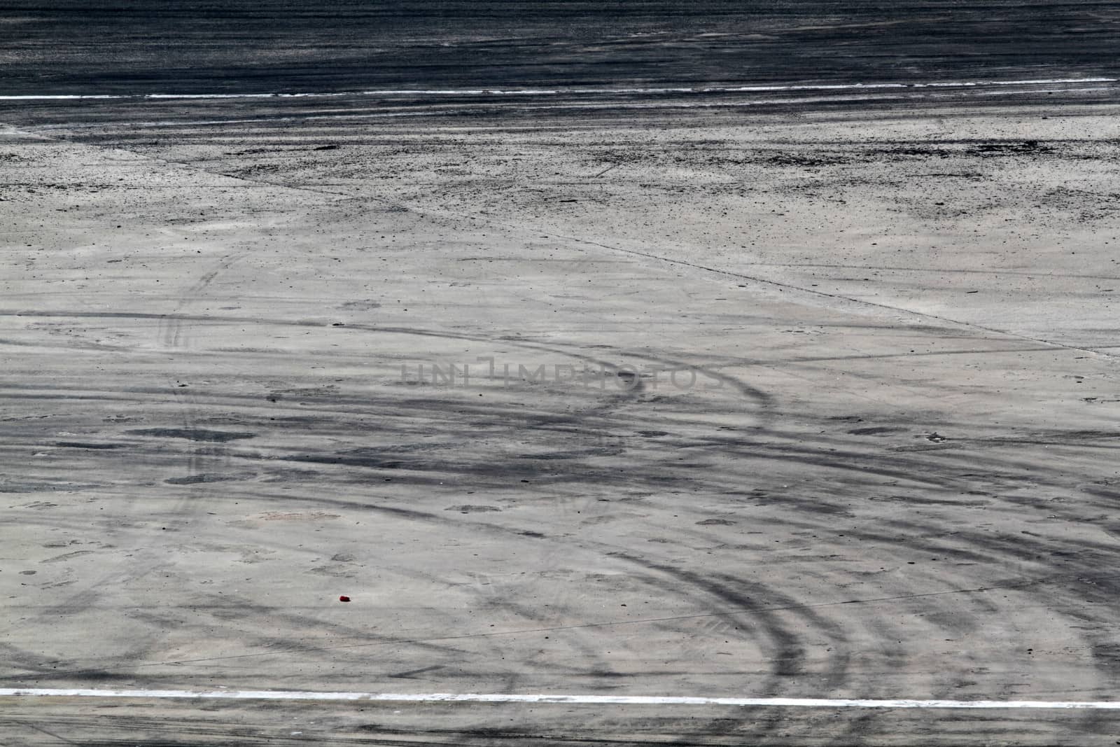Background with tire marks on road track