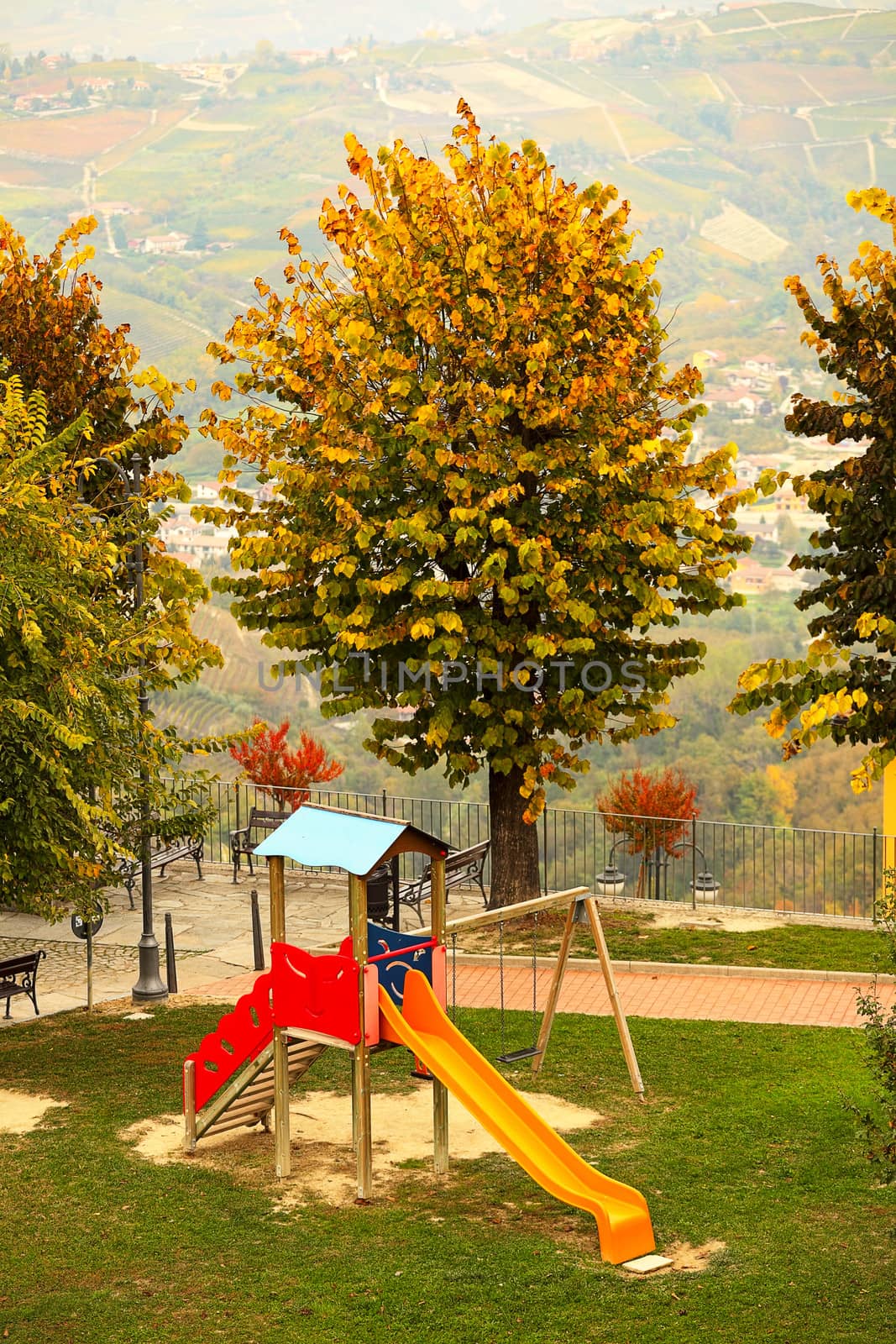 Slide on empty playground. by rglinsky