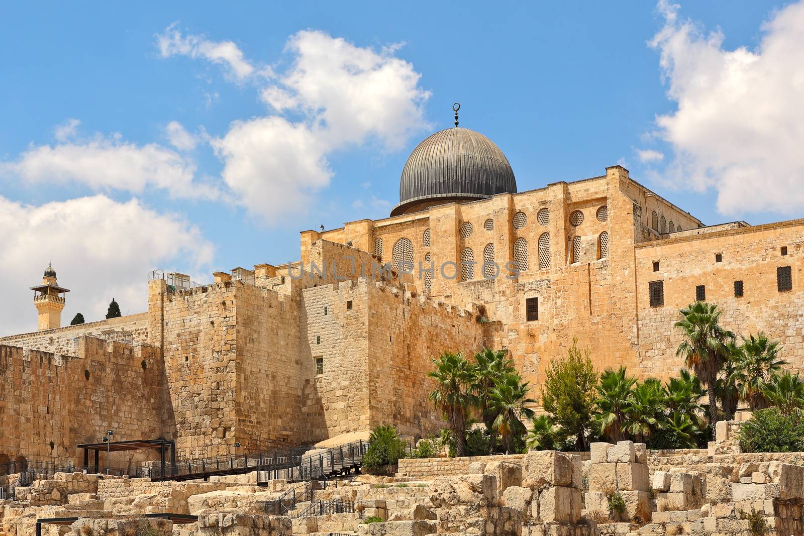 Dome of Al-Aqsa Mosque surrounded by walls and ancient ruins in Old City of Jerusalem, Israel.