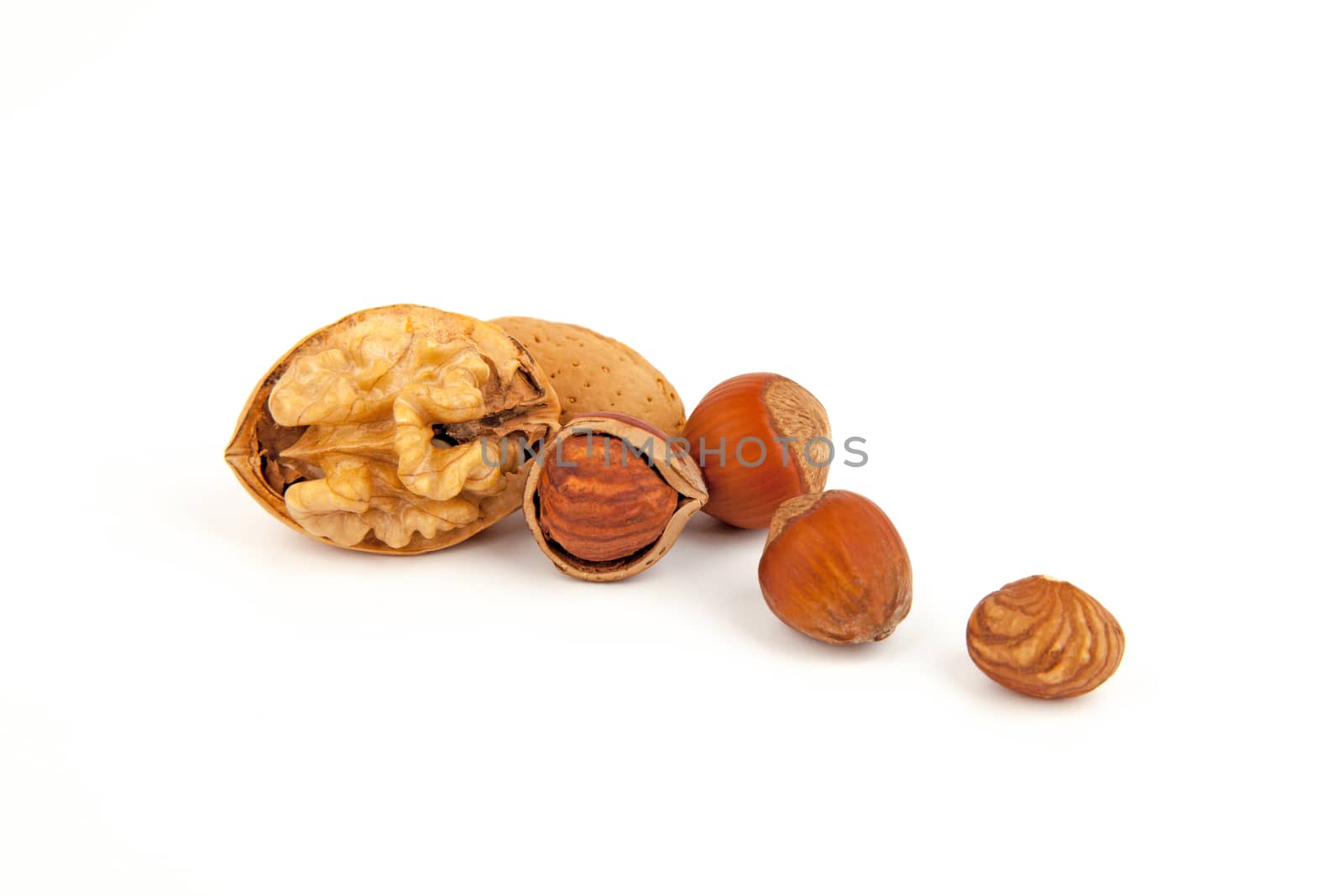 Mix nuts (hazelnuts, walnuts), isolated om white background.