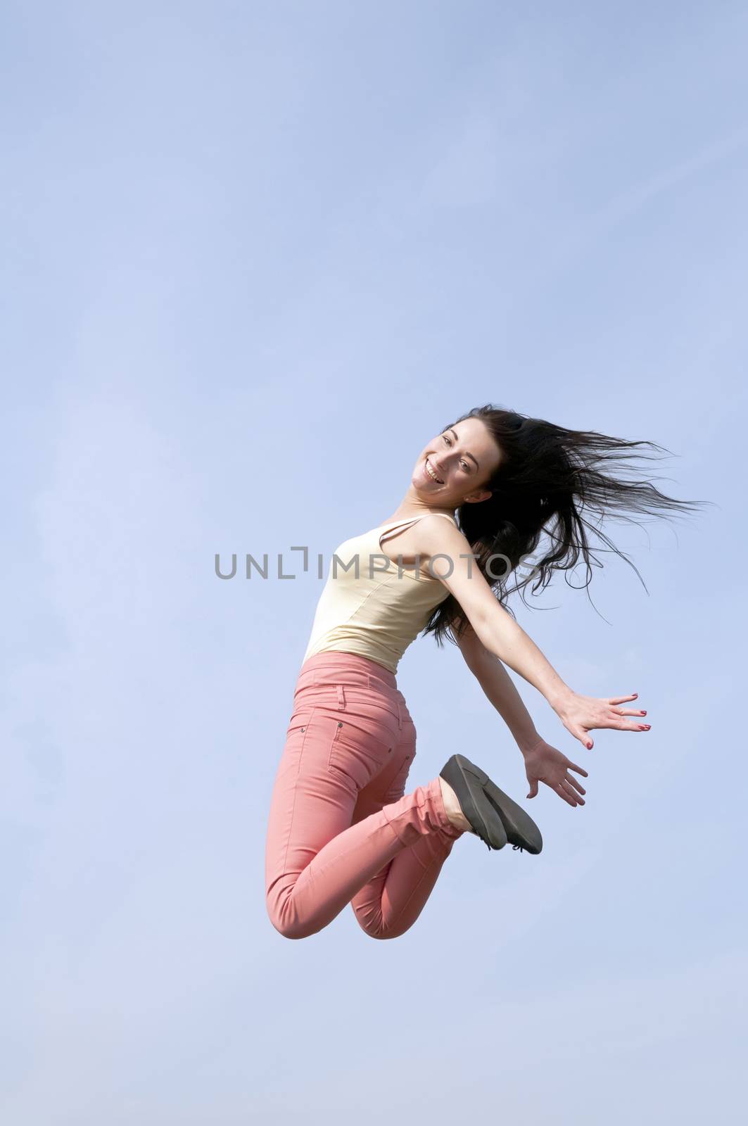 happy smiling woman doing joyful leap