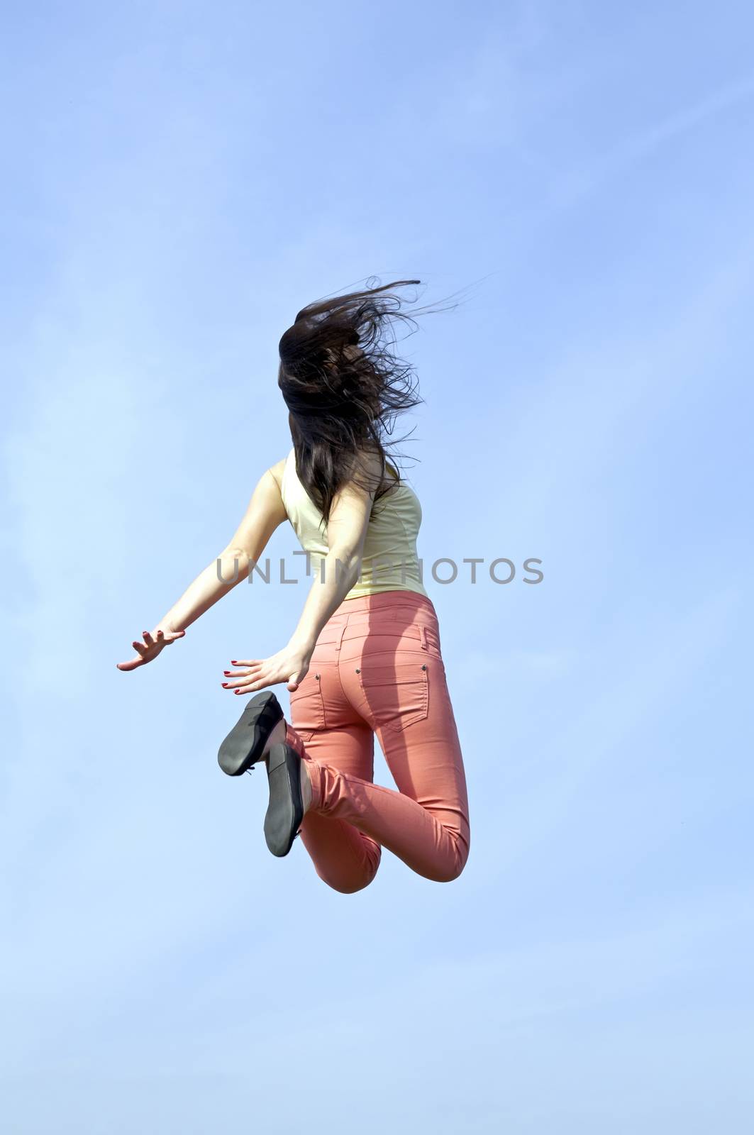  rear view of joyful leap
