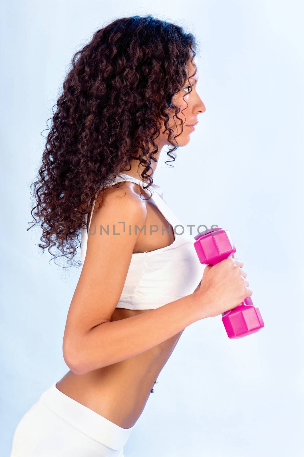 Young woman doing fitness exercises, side view