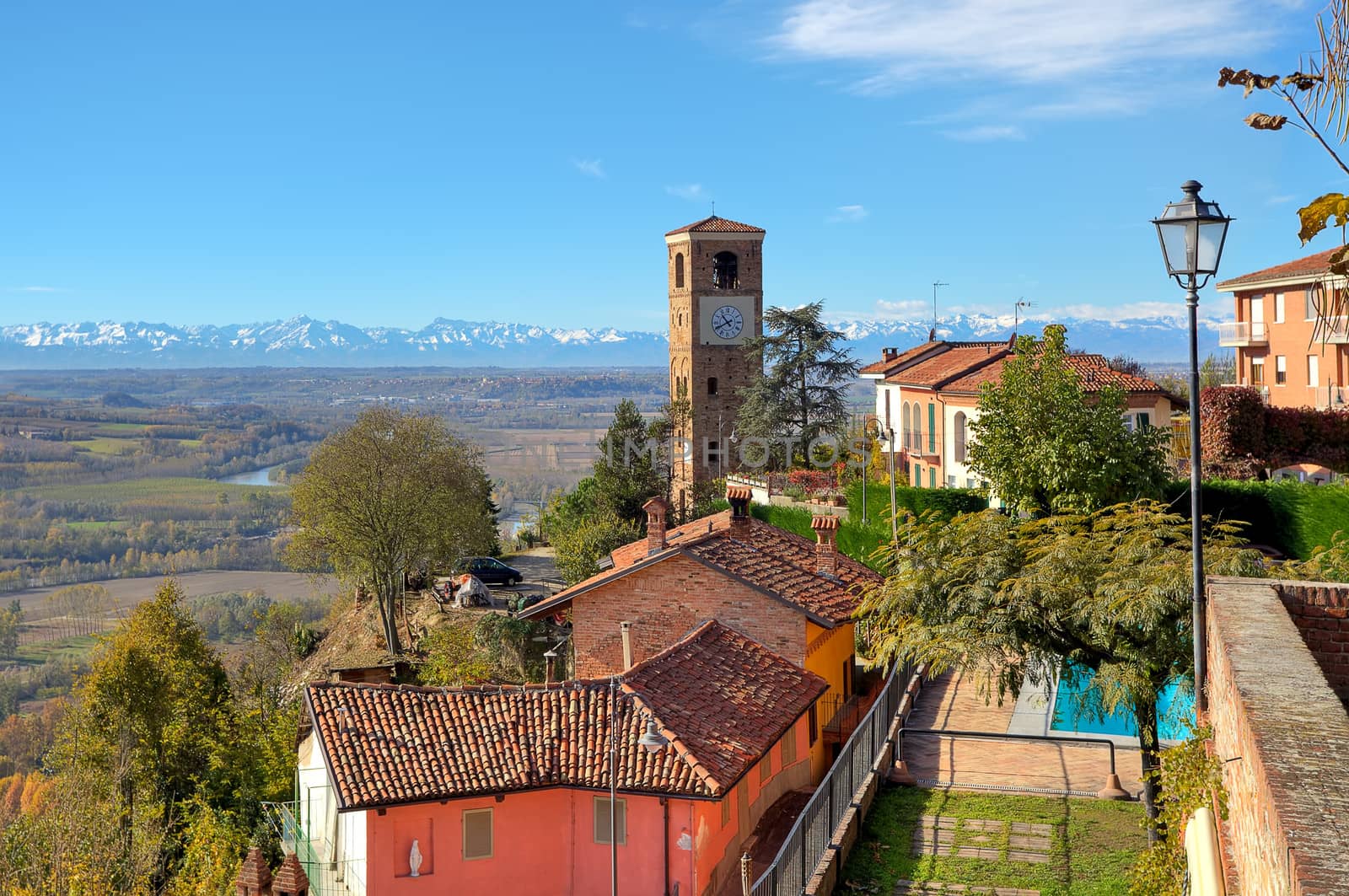 View of small town and old brick belfry in Santa Vittoria D'Alba in Piedmont, Northern Italy.