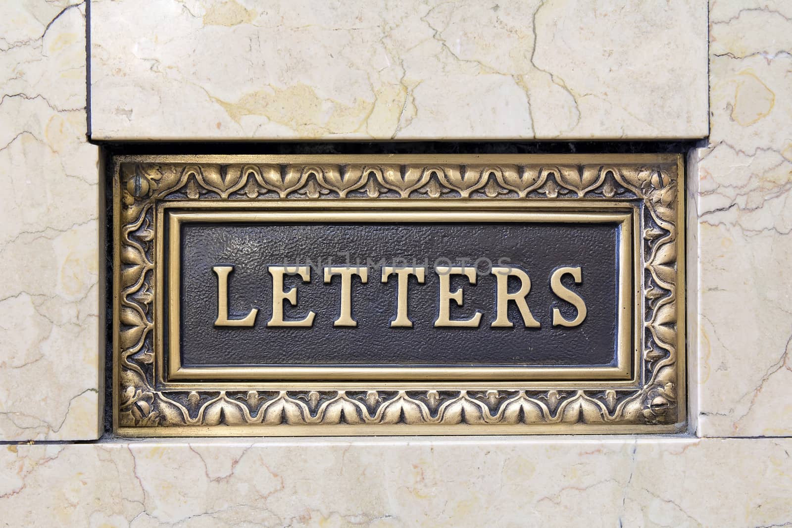 Old Antique Letter Mail Box in Marble Wall