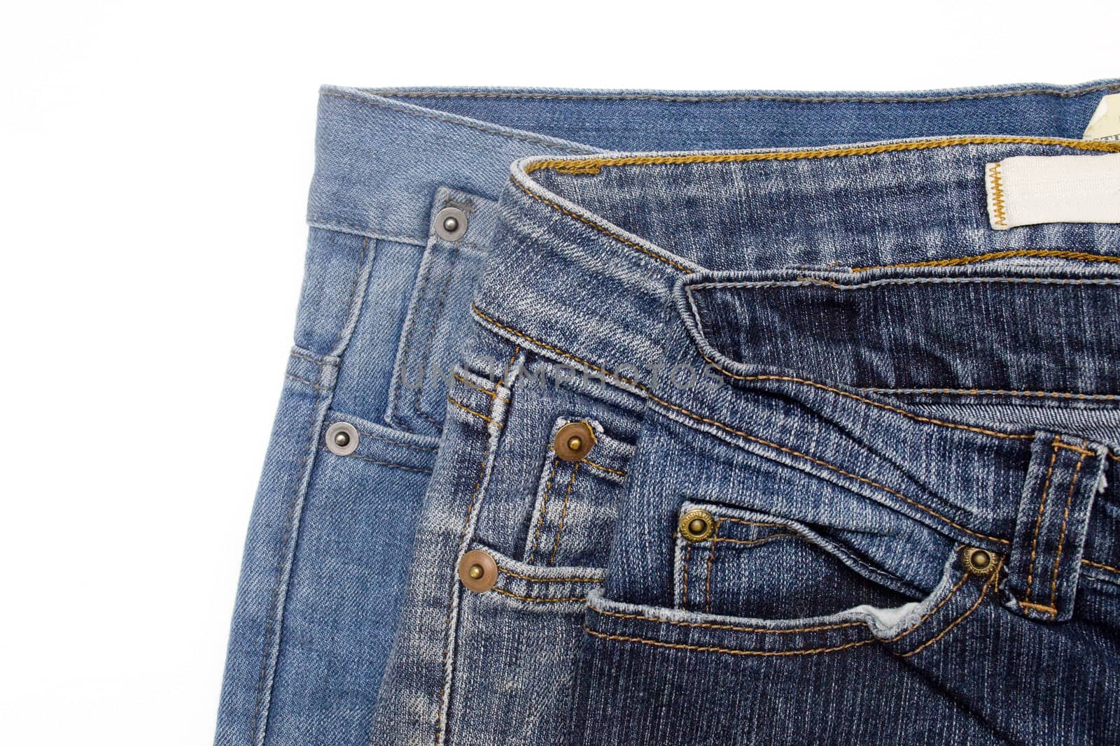 Close up image of denim jeans pocket with a ripped hole