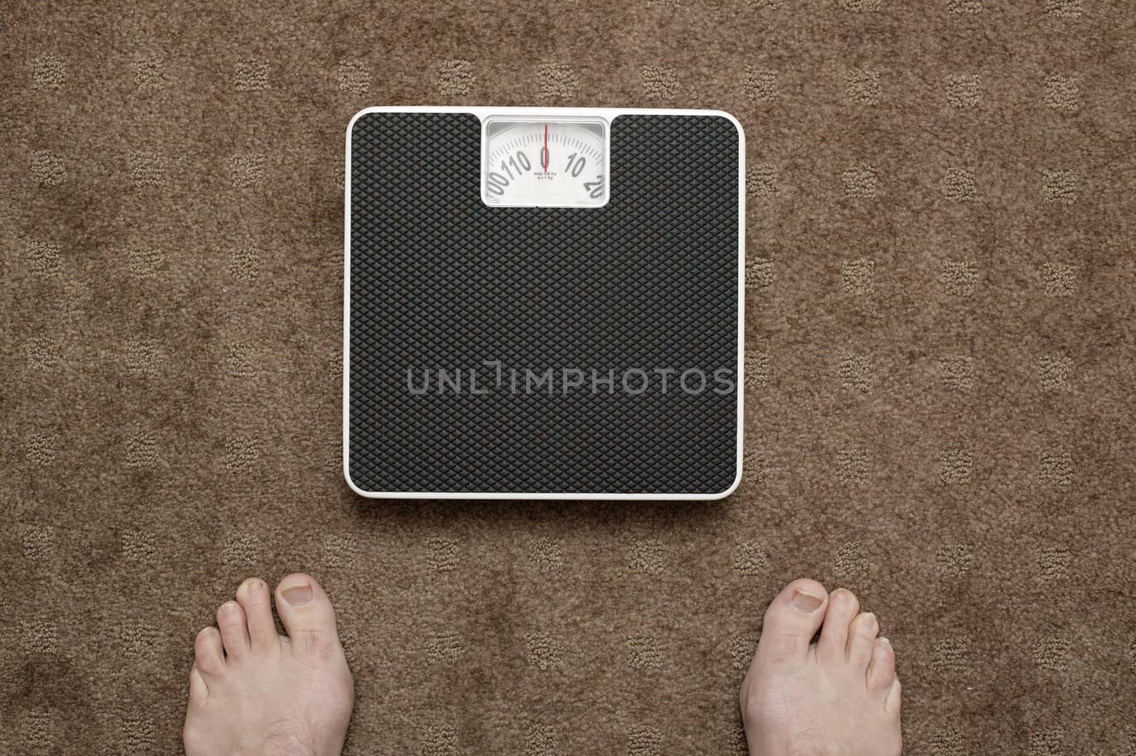 Bathroom scales isolated against a white background