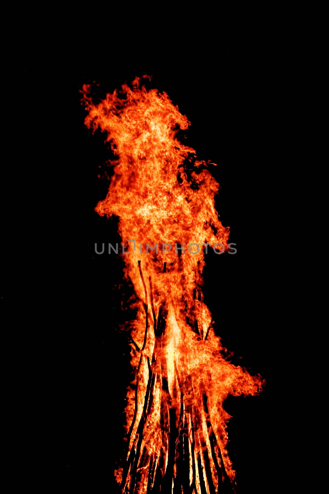 red flames of huge bonfire or campfire as black backgorund