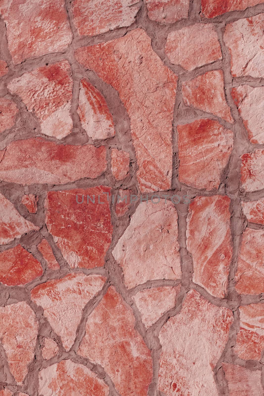 Background of a large stone wall texture (red)