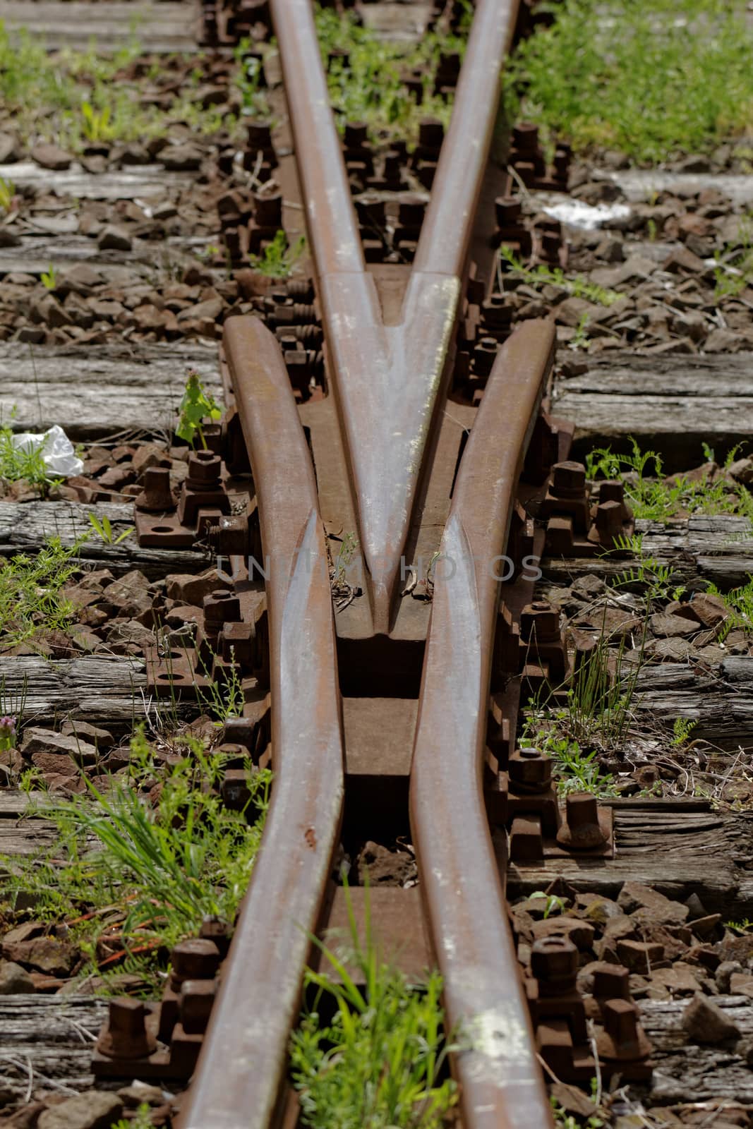 rusty railway track crossing