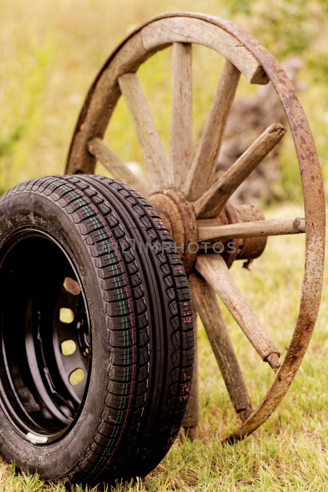 new and old broken wagon (car) wheel